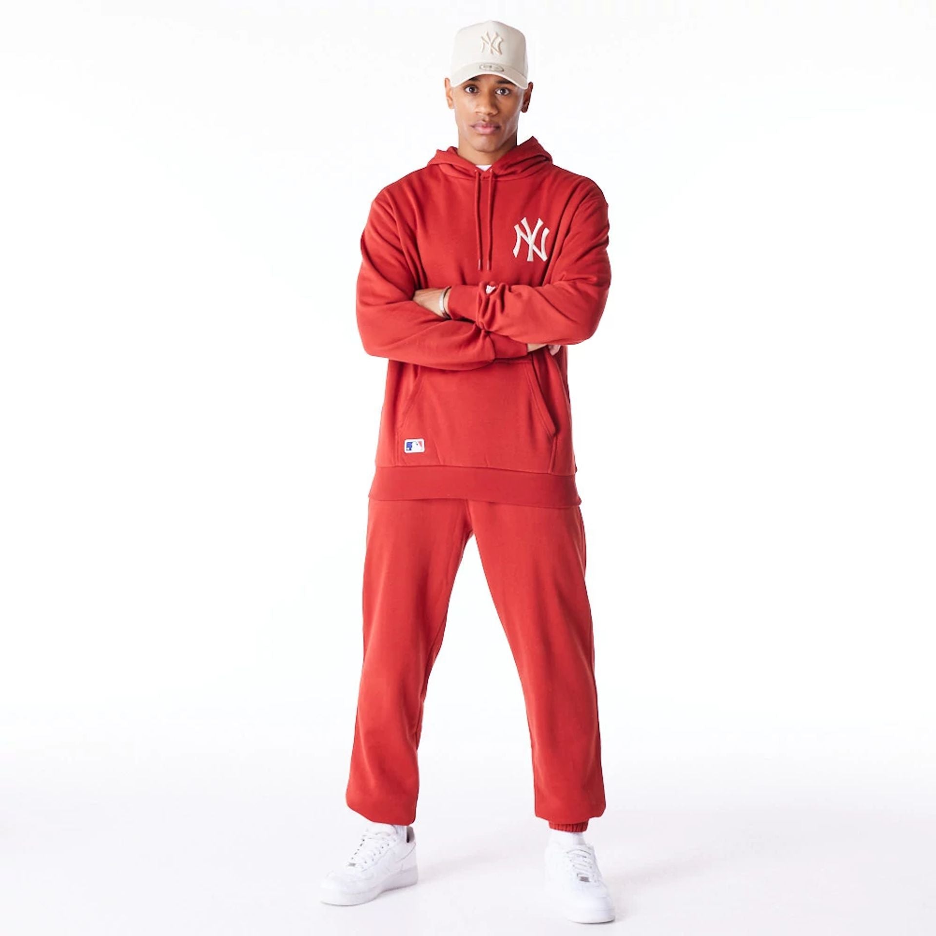 The Male model is wearing New York Yankees League Essential Red Oversized Pullover Hoodie 11