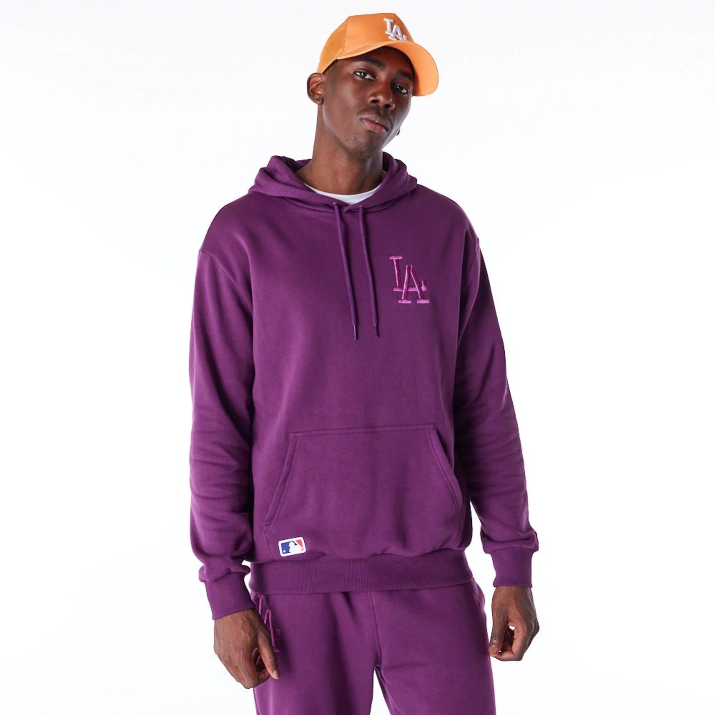 The Male model is wearing LA Dodgers League Essential Dark Purple Oversized Pullover Hoodie 1