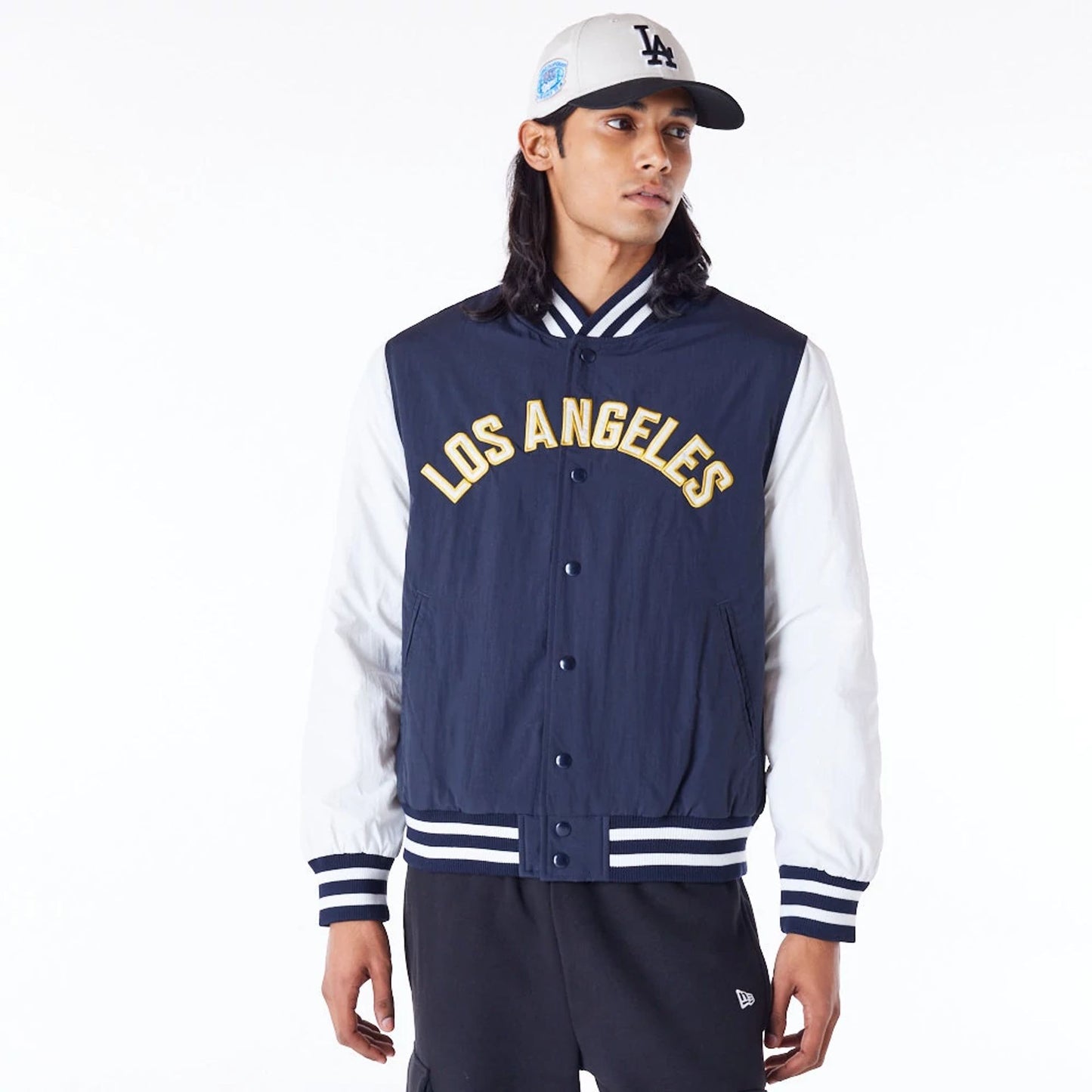 The Male model is wearing LA Dodgers MLB Wordmark Navy Bomber Jacket 1