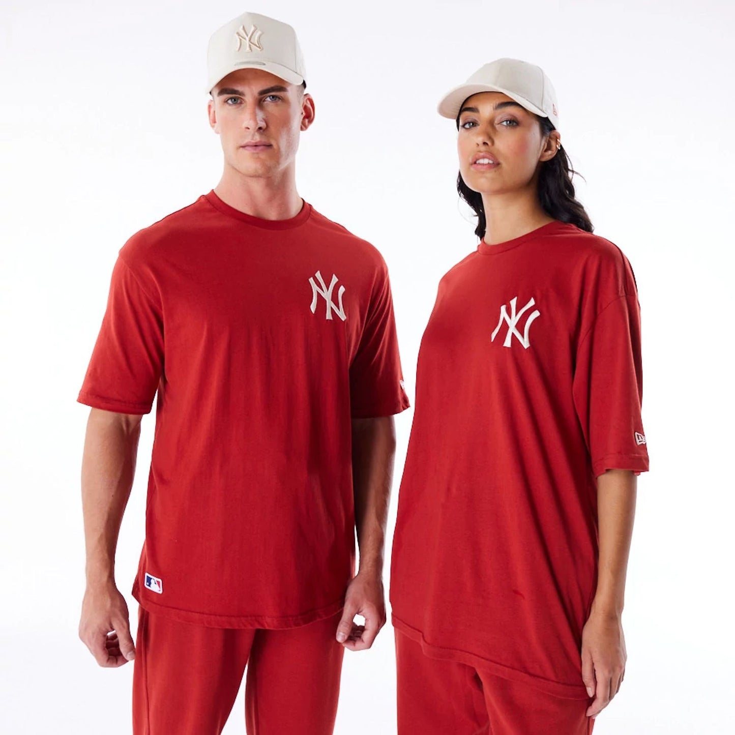 The Male model is wearing New York Yankees League Essential Red Oversized T-Shirt 1