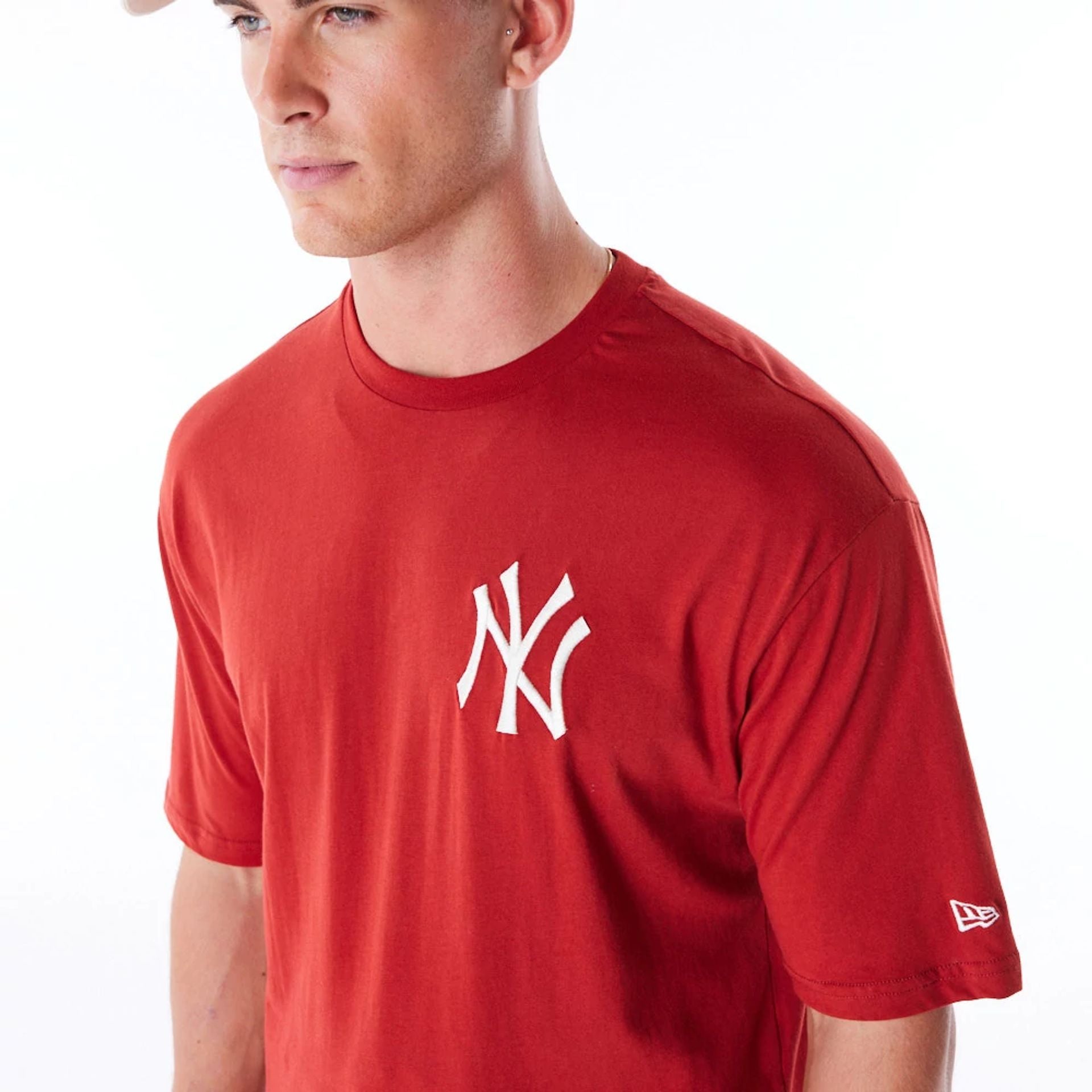 The Male model is wearing New York Yankees League Essential Red Oversized T-Shirt 5