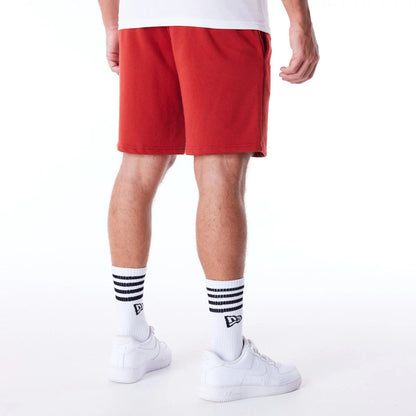 The Male model is wearing New York Yankees League Essential Red Shorts 8