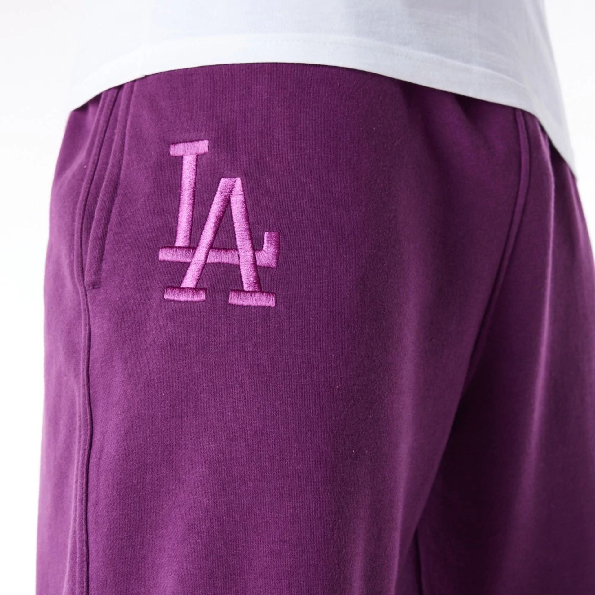 The Male model is wearing LA Dodgers League Essential Dark Purple Fleece Joggers 3