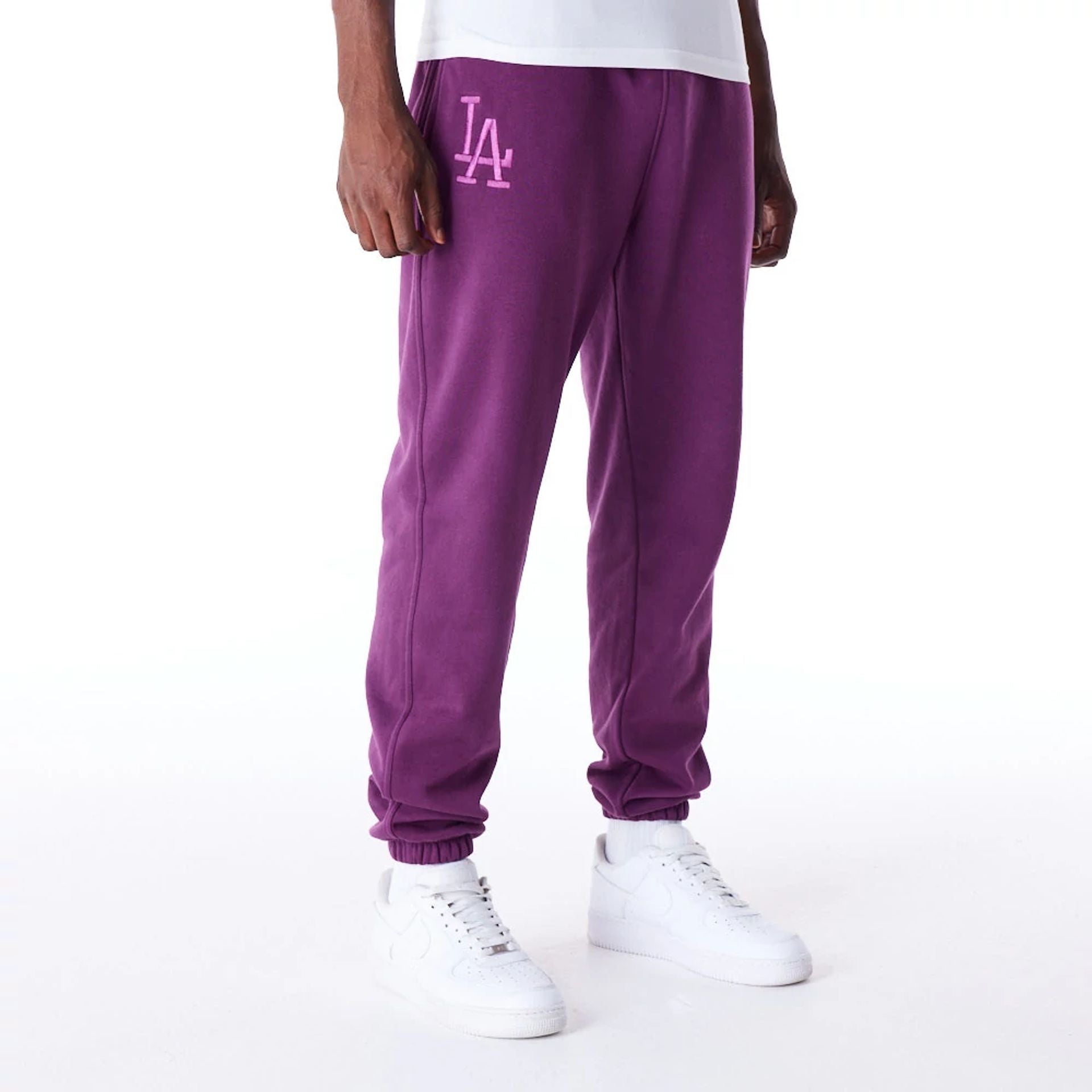 The Male model is wearing LA Dodgers League Essential Dark Purple Fleece Joggers 1