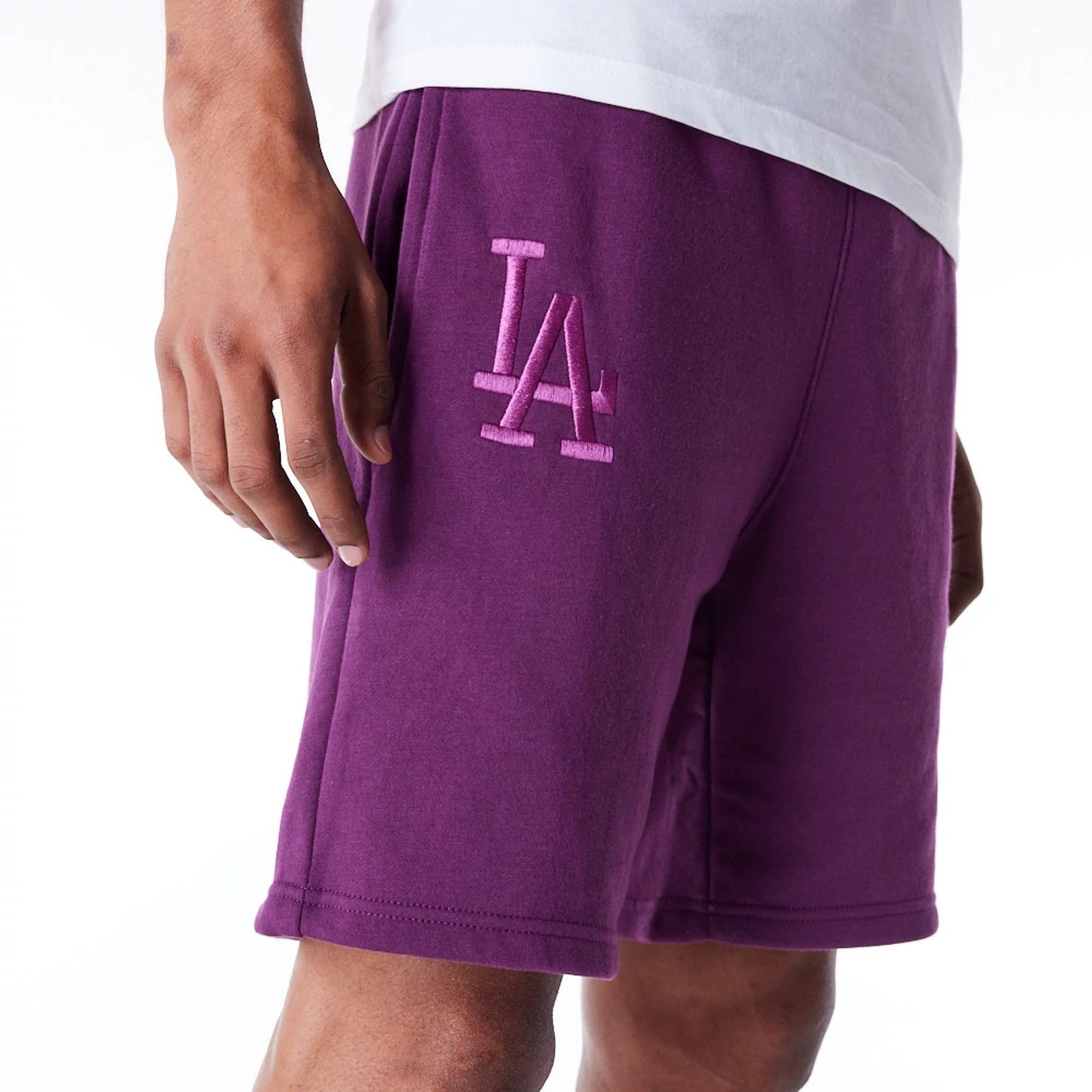 The Male model is wearing LA Dodgers League Essential Dark Purple Shorts 3