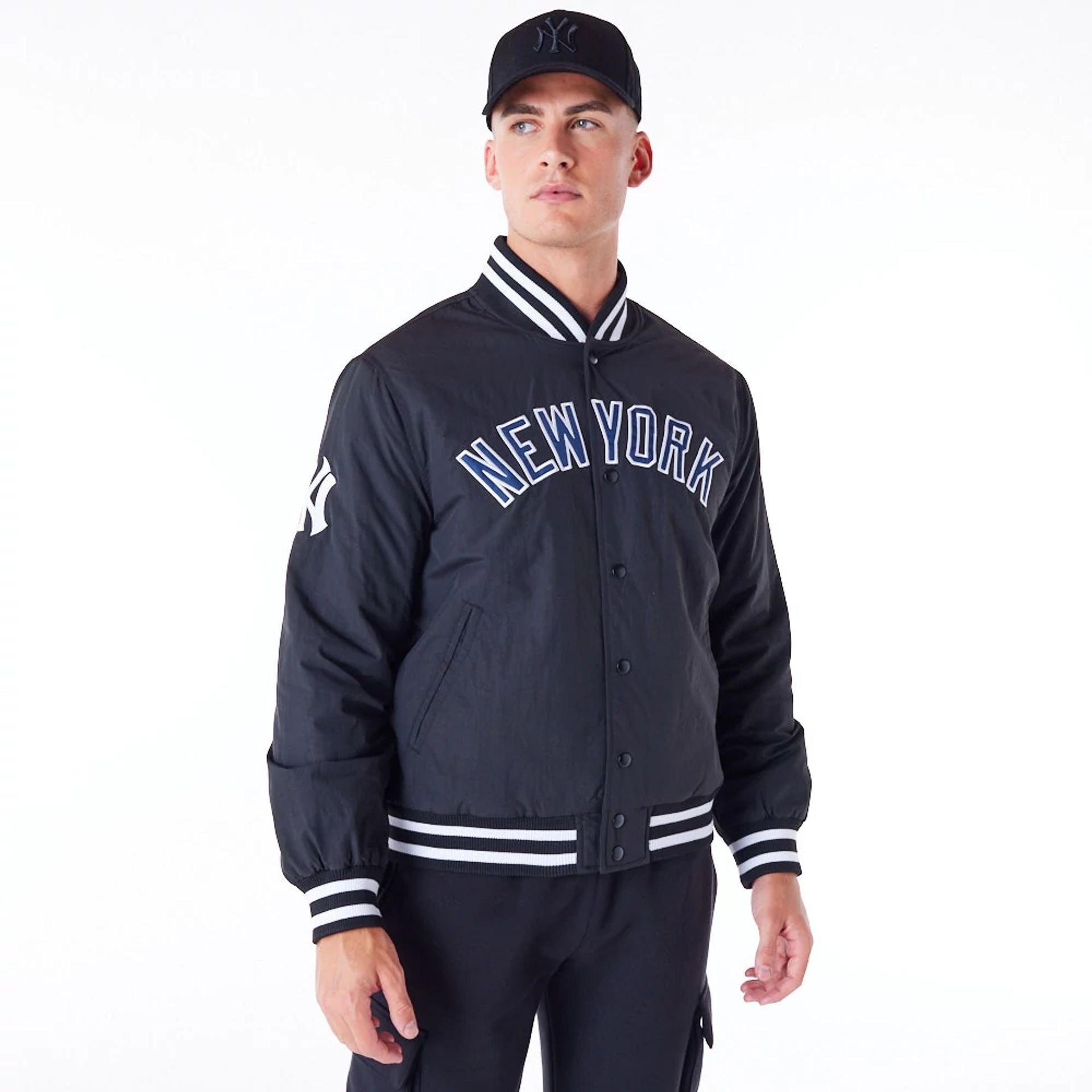 The Male model is wearing New York Yankees MLB Wordmark Black Bomber Jacket 1