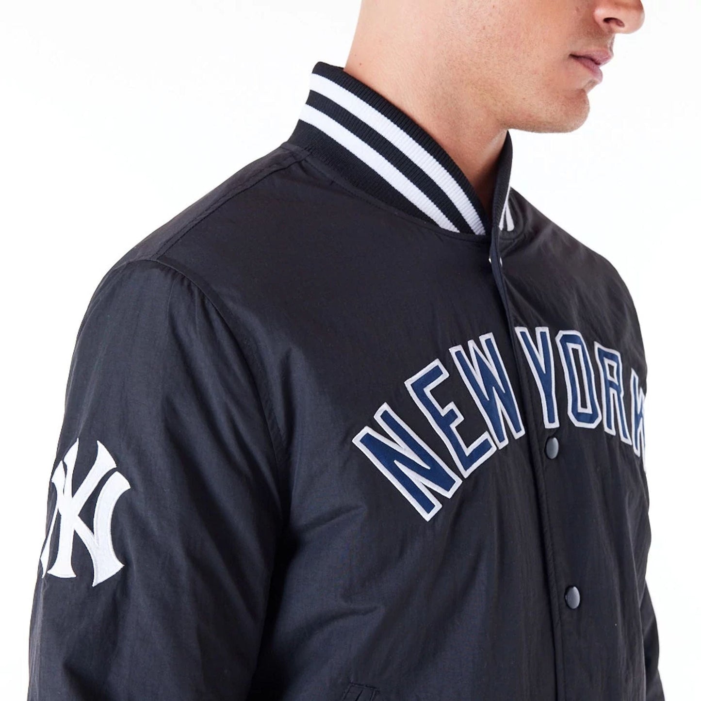 The Male model is wearing New York Yankees MLB Wordmark Black Bomber Jacket 4