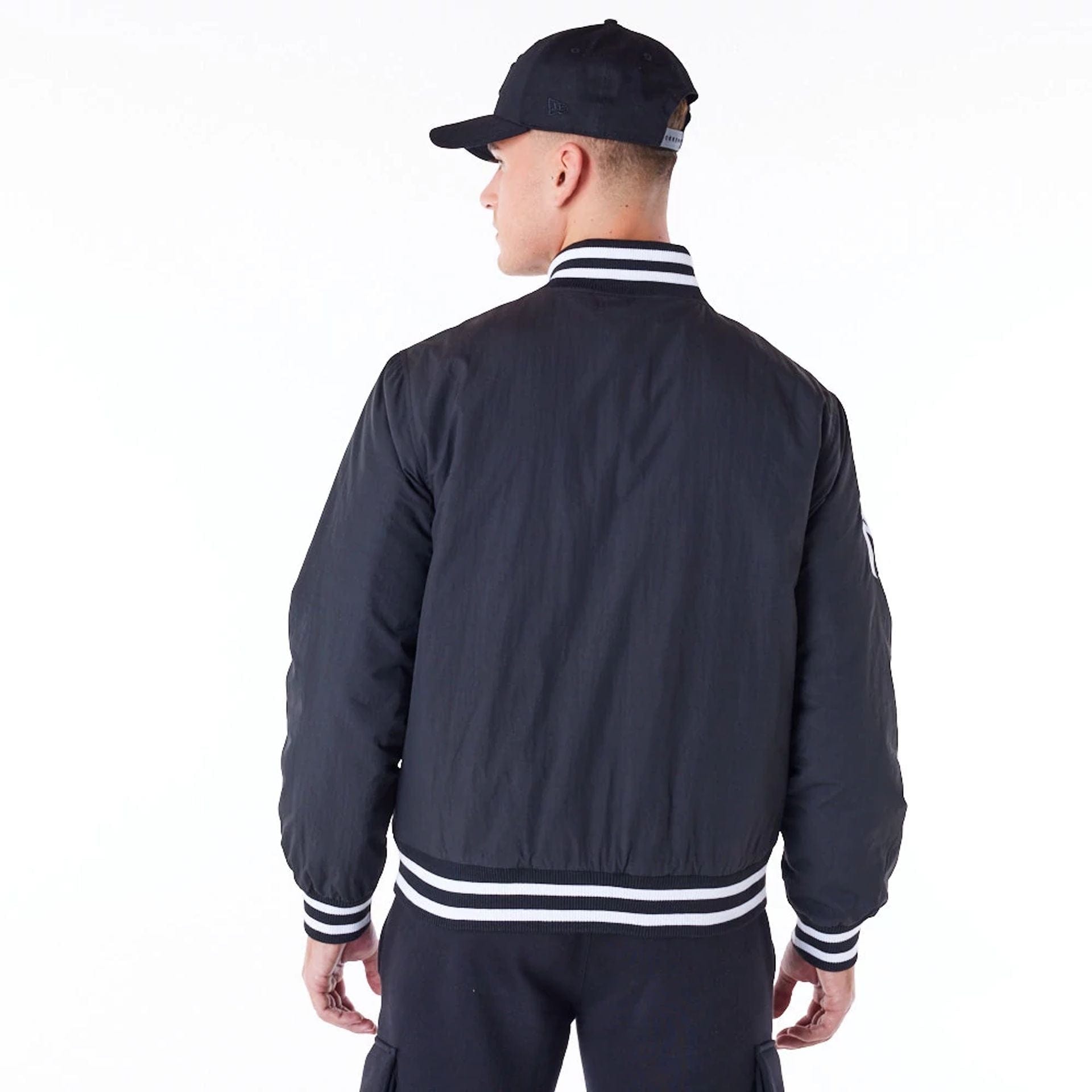 The Male model is wearing New York Yankees MLB Wordmark Black Bomber Jacket 3