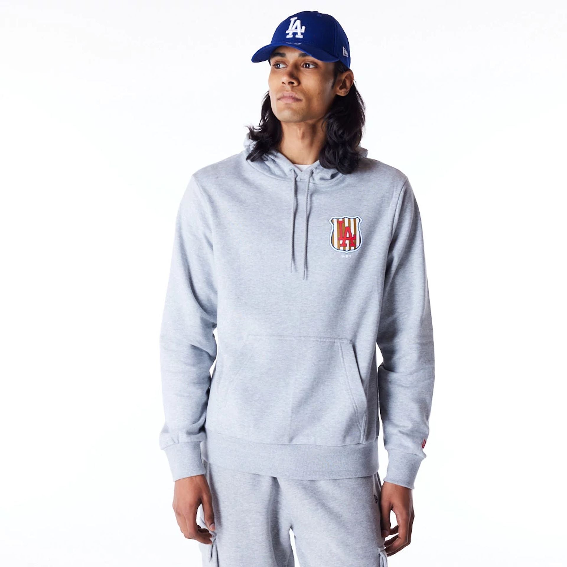 The Male model is wearing LA Dodgers MLB Badge Graphic Grey Pullover Hoodie 2