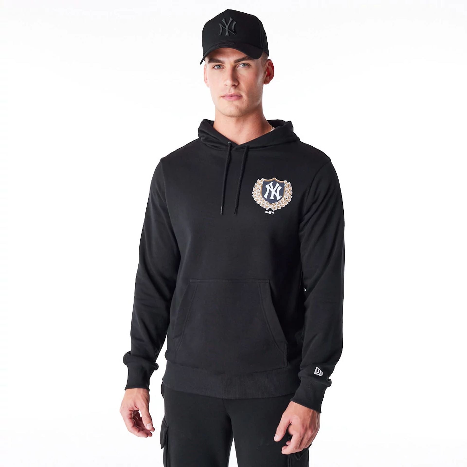 The Male model is wearing New York Yankees MLB Badge Graphic Black Pullover Hoodie 1