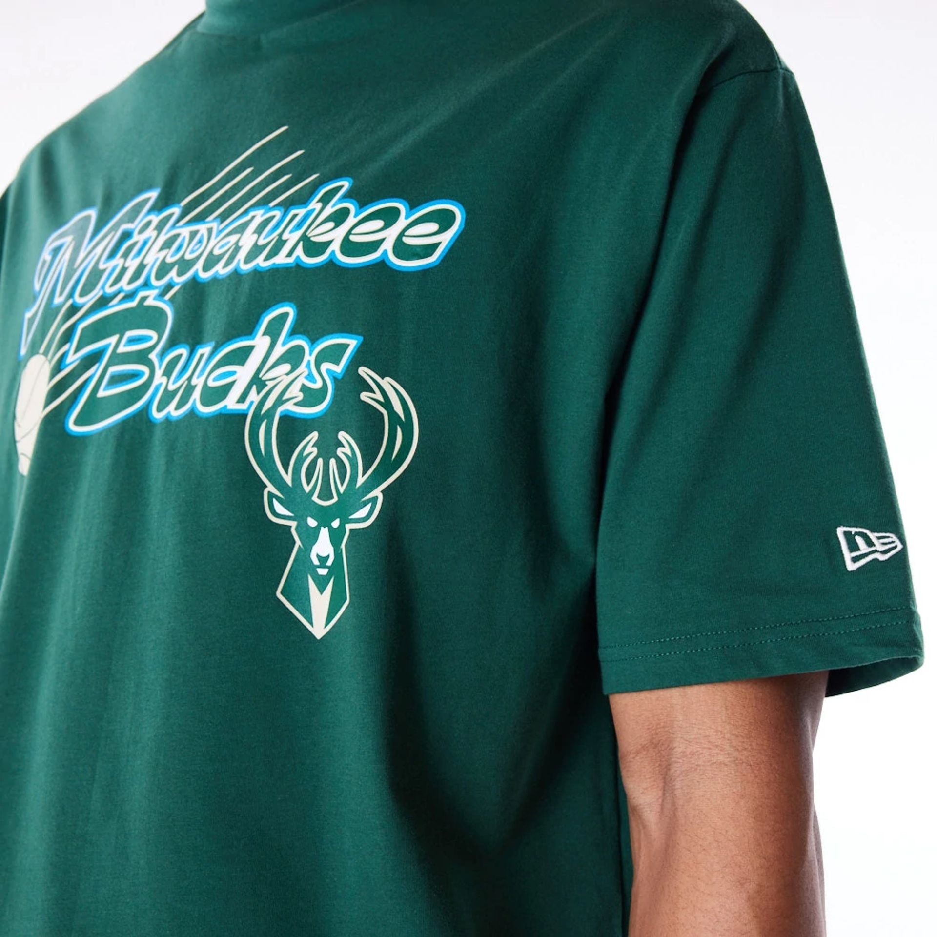 The Male model is wearing Milwaukee Bucks NBA Script Dark Green Oversized T-Shirt 5