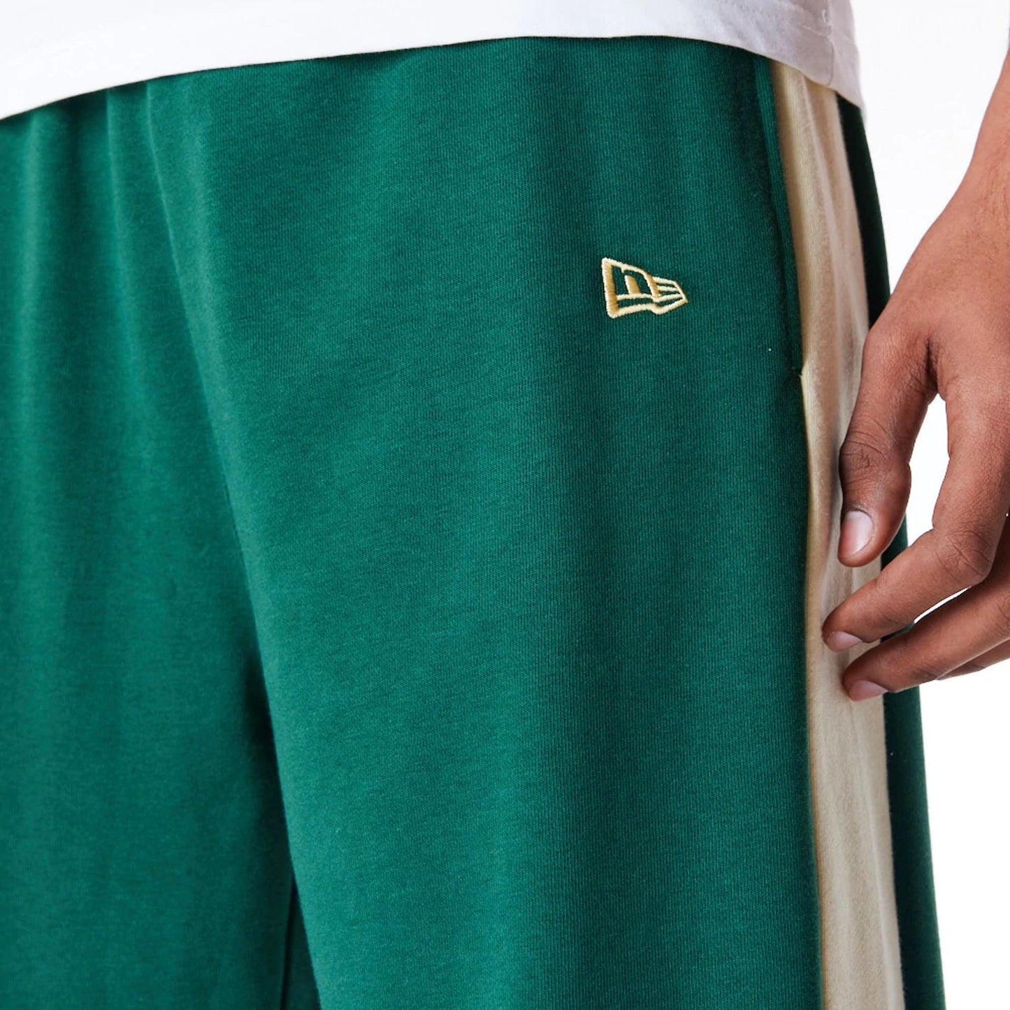 The Male model is wearing Milwaukee Bucks NBA Panel Dark Green Fleece Joggers 4