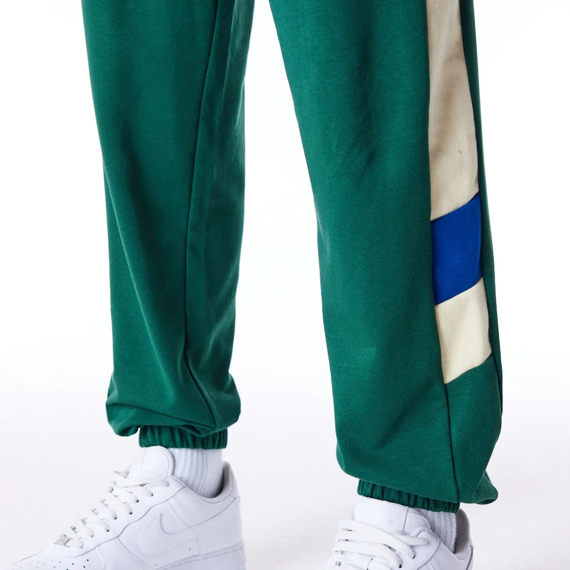 The Male model is wearing Milwaukee Bucks NBA Panel Dark Green Fleece Joggers 5