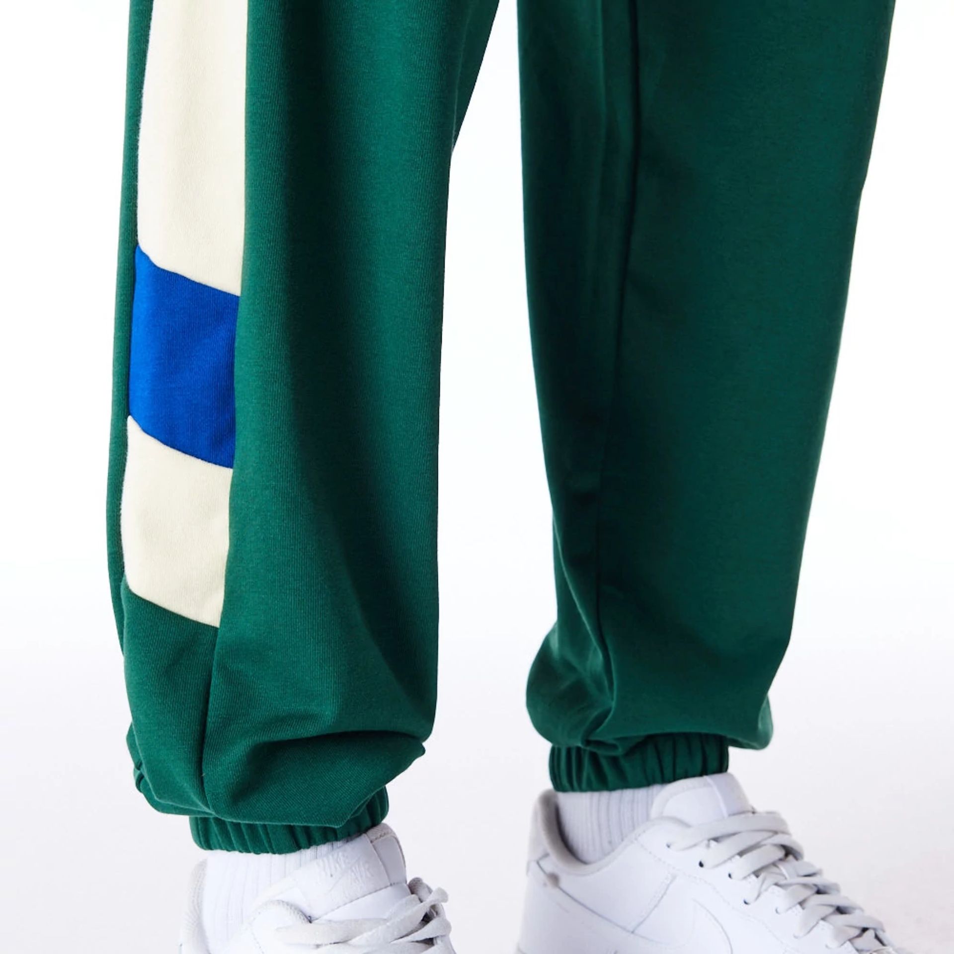 The Male model is wearing Milwaukee Bucks NBA Panel Dark Green Fleece Joggers 2