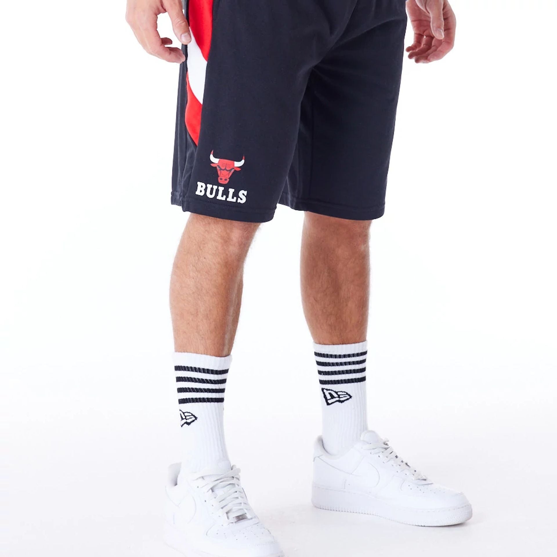 The Male model is wearing Chicago Bulls NBA Panel Black Oversized Shorts 1