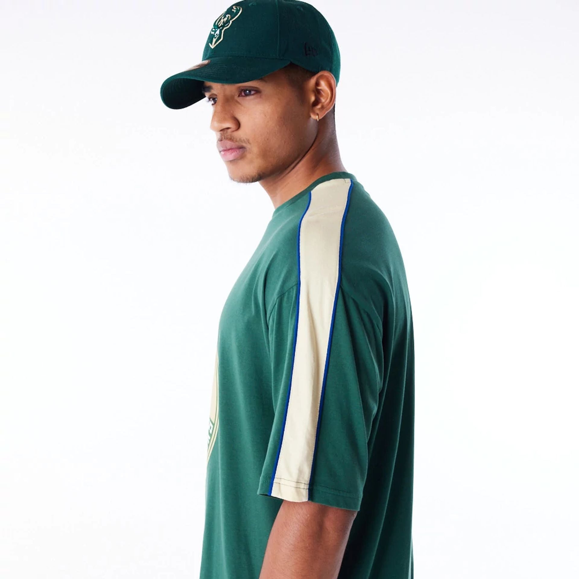 The Male model is wearing Milwaukee Bucks NBA Panel Dark Green Oversized T-Shirt 4