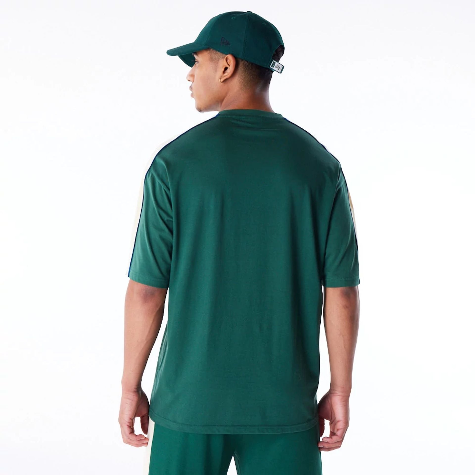 The Male model is wearing Milwaukee Bucks NBA Panel Dark Green Oversized T-Shirt 8