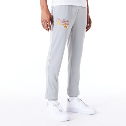 The Male model is wearing LA Lakers NBA Script Grey Fleece Track Joggers 1