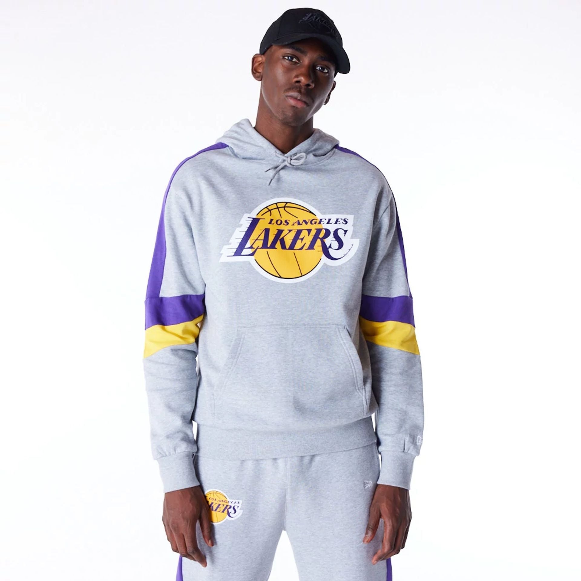 The Male model is wearing LA Lakers Colour Block Grey Pullover Hoodie  1