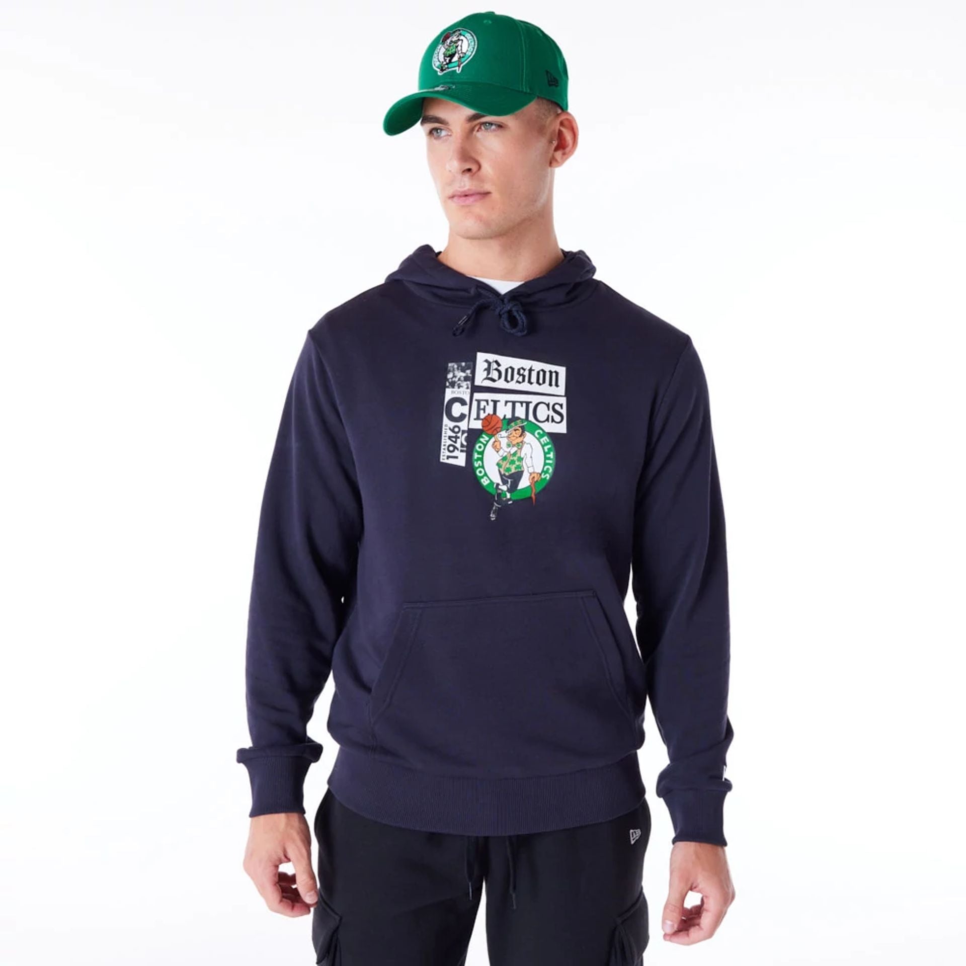 The Male model is wearing Boston Celtics Newspaper Graphic Navy Pullover Hoodie 2