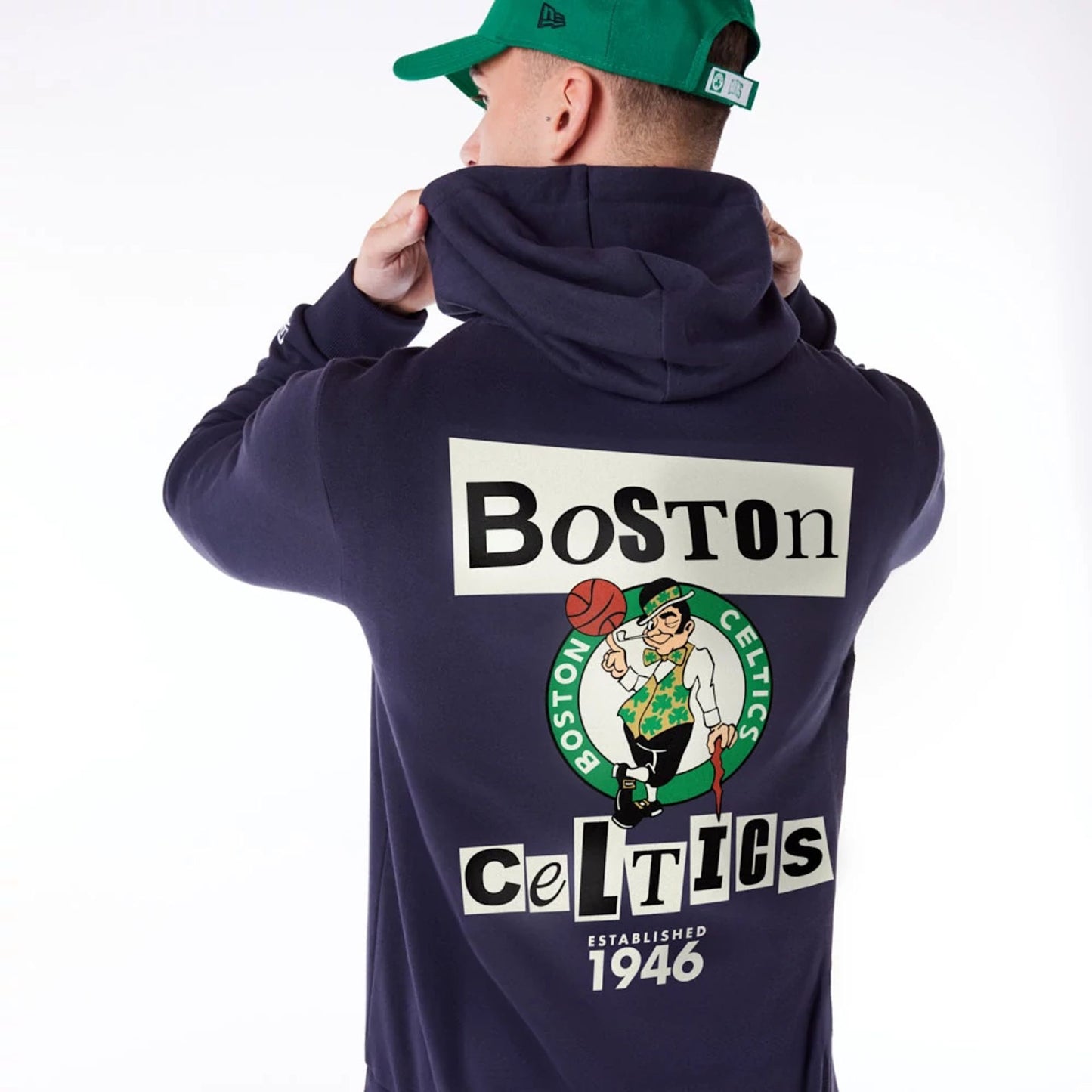 The Male model is wearing Boston Celtics Newspaper Graphic Navy Pullover Hoodie 3