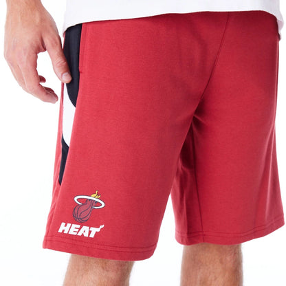 The Male model is wearing Miami Heat NBA Panel Dark Red Oversized Shorts 4