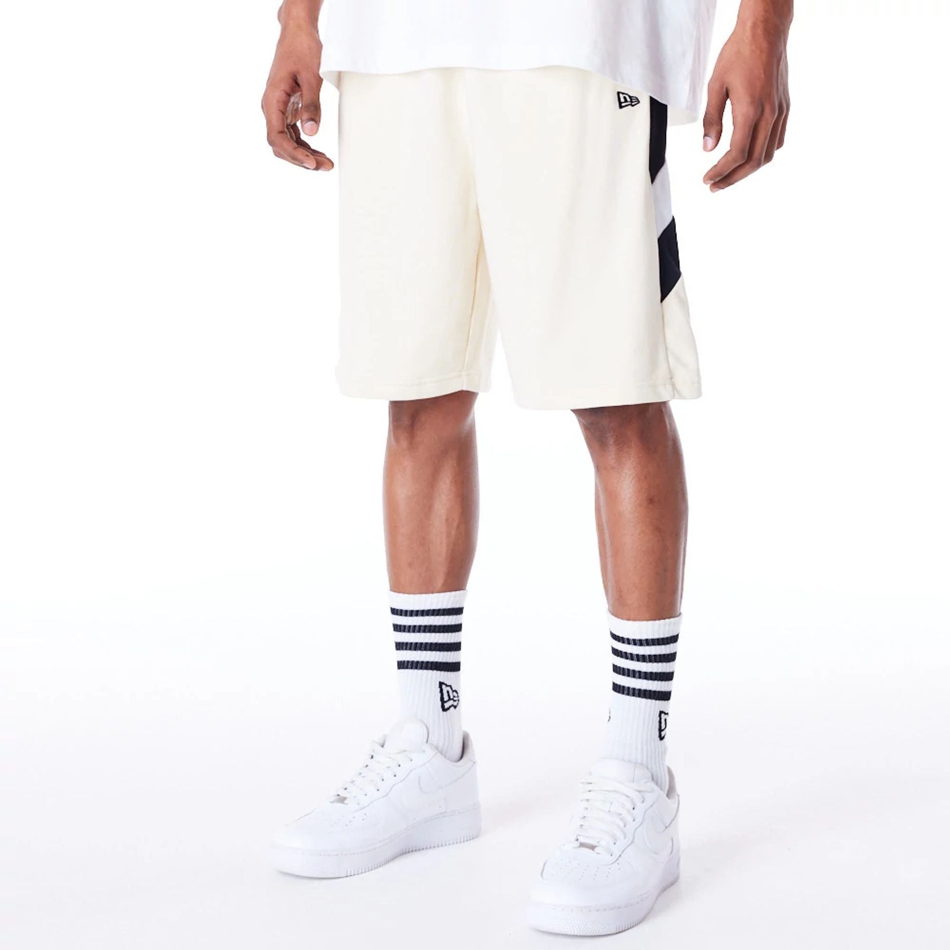 The Male model is wearing Boston Celtics NBA Panel Stone Oversized Shorts 3