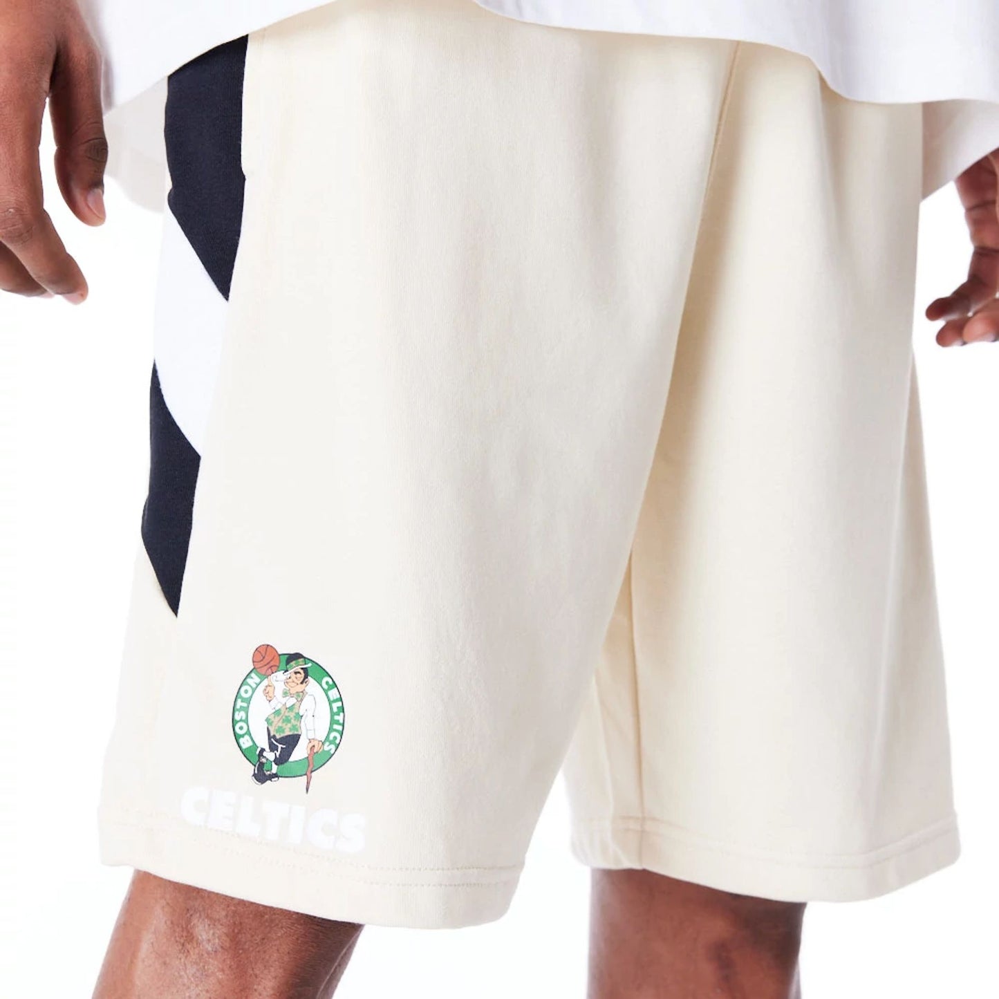 The Male model is wearing Boston Celtics NBA Panel Stone Oversized Shorts 1