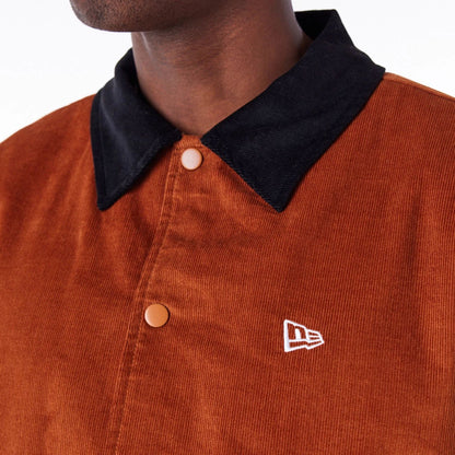 The Male model is wearing New Era Brown Cord Coach Jacket 2