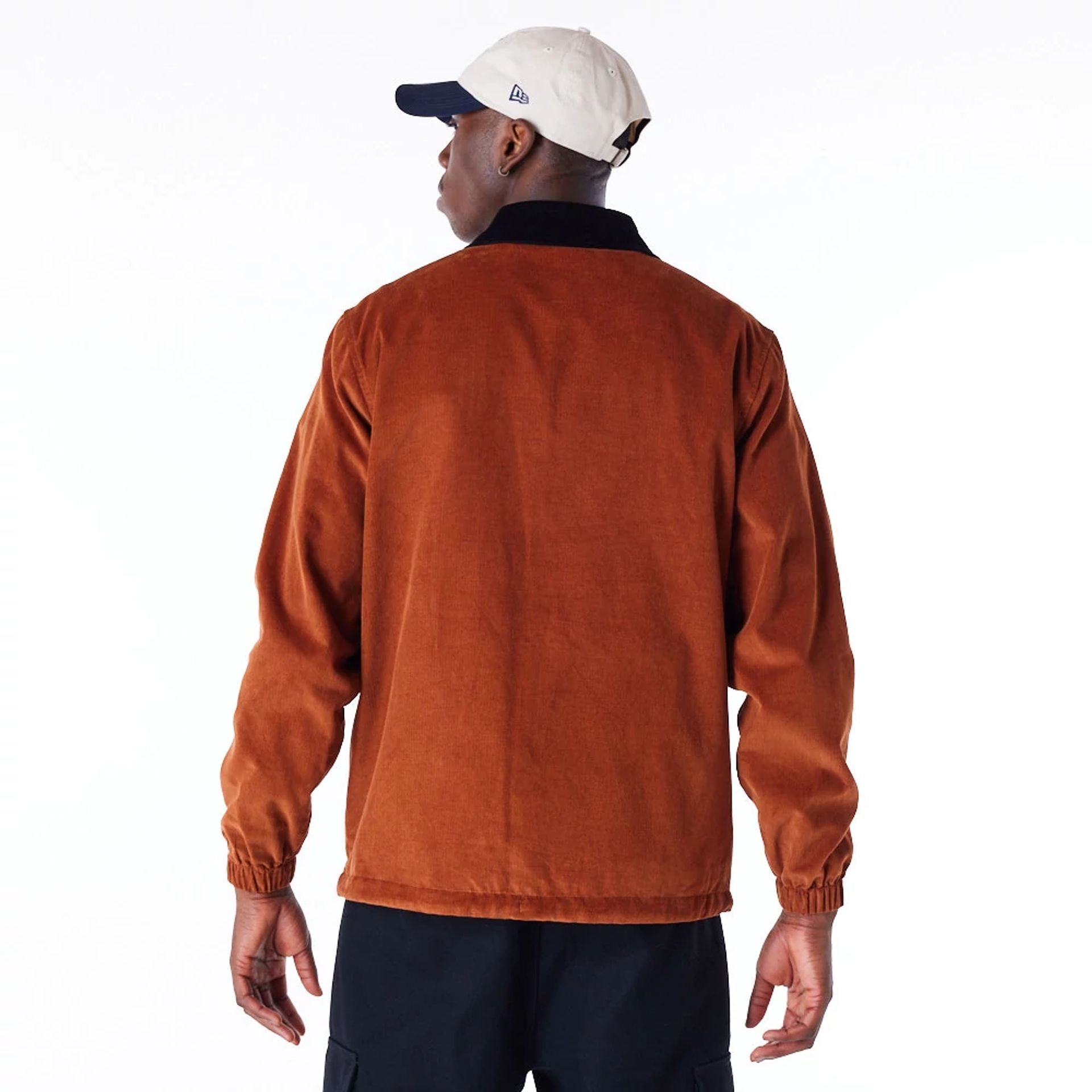 The Male model is wearing New Era Brown Cord Coach Jacket 5