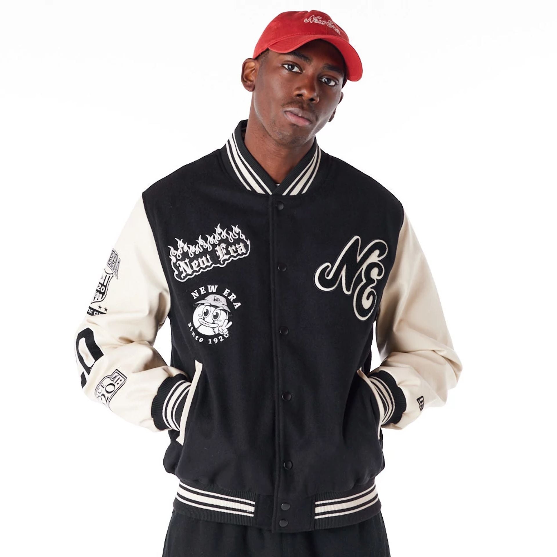 The Male model is wearing New Era Varisty Patch Black Varsity Jacket 1