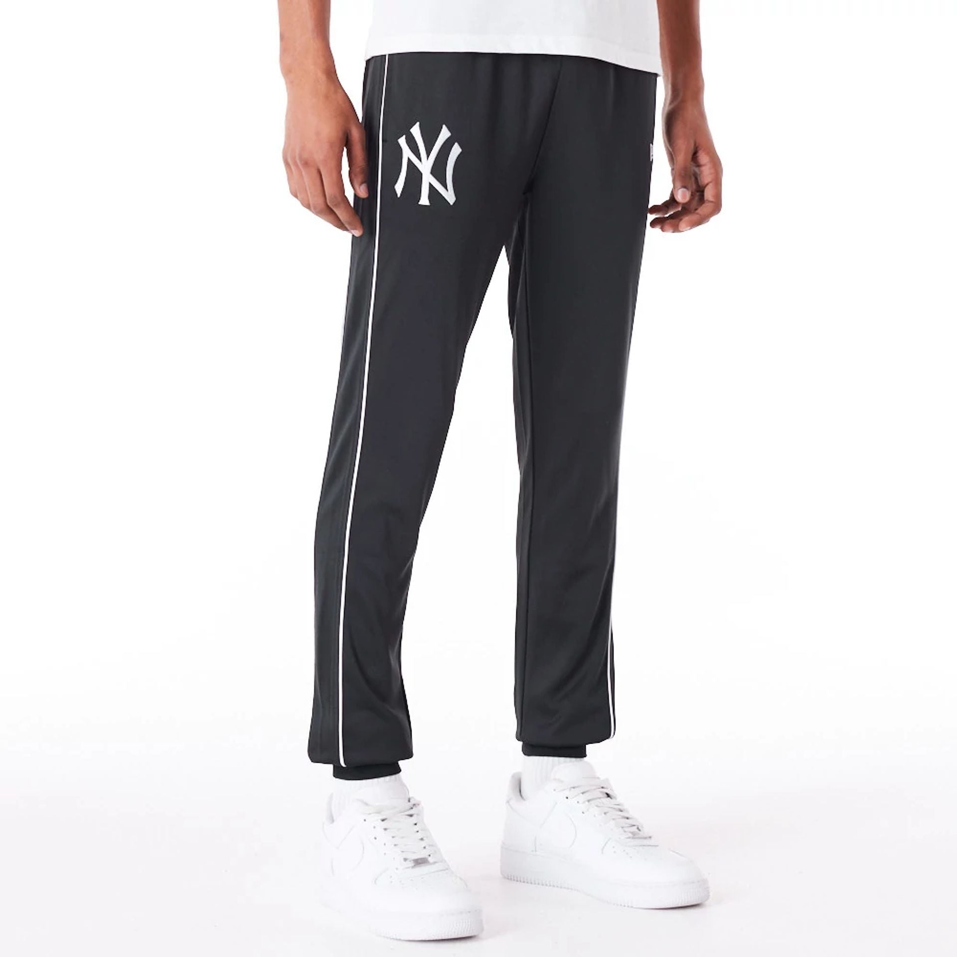 The Male model is wearing New York Yankees MLB Track Pant Black Fleece Track Joggers 1