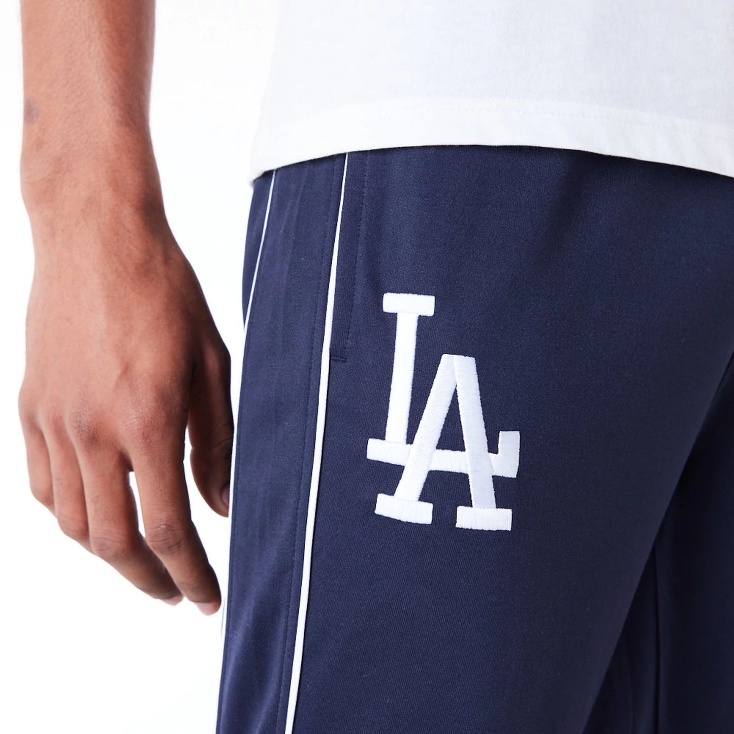 The Male model is wearing LA Dodgers MLB Track Pant Dark Blue Fleece Track Joggers 9