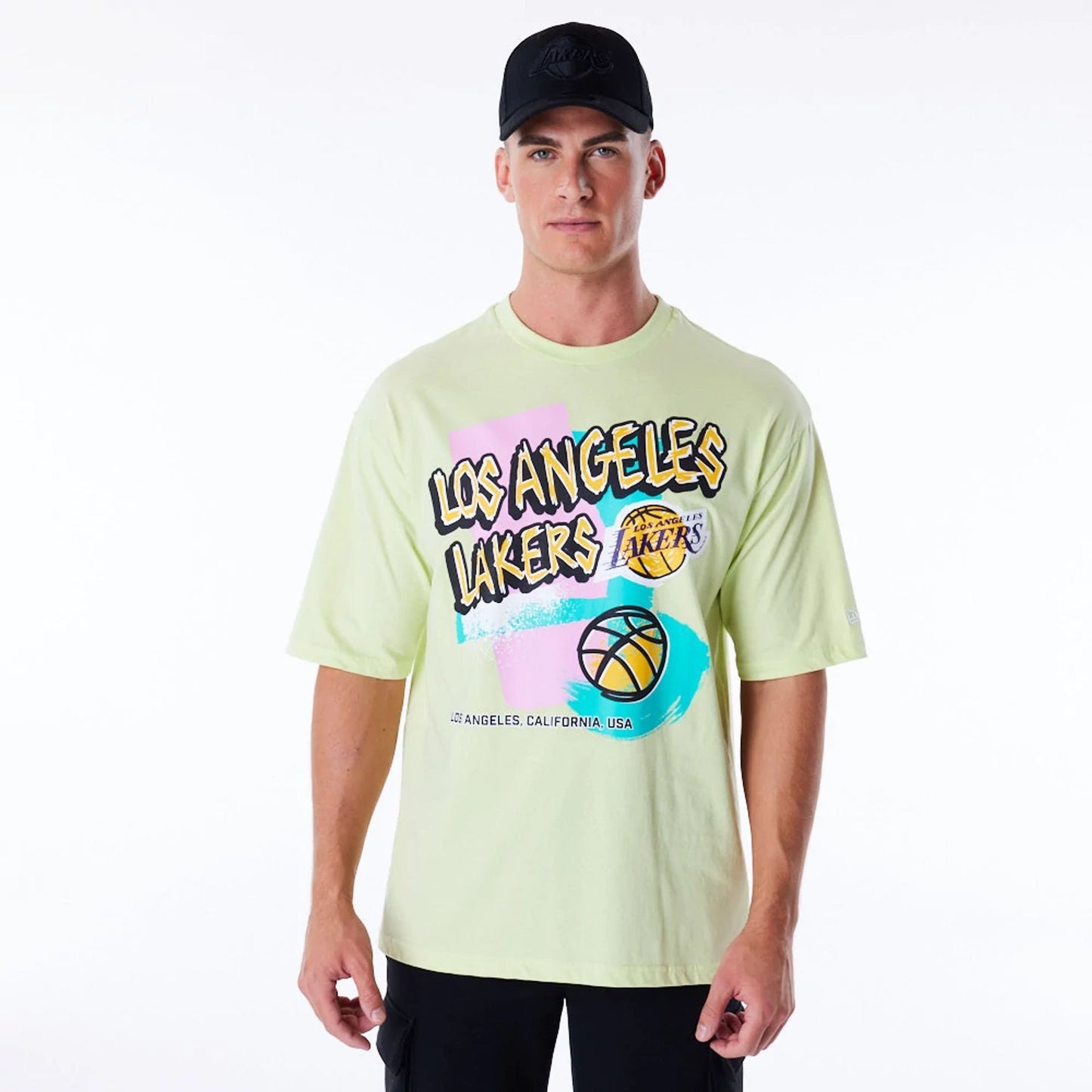 The Male model is wearing LA Lakers Retro Graphic Pastel Green Oversized T-Shirt 1