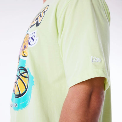 The Male model is wearing LA Lakers Retro Graphic Pastel Green Oversized T-Shirt 2