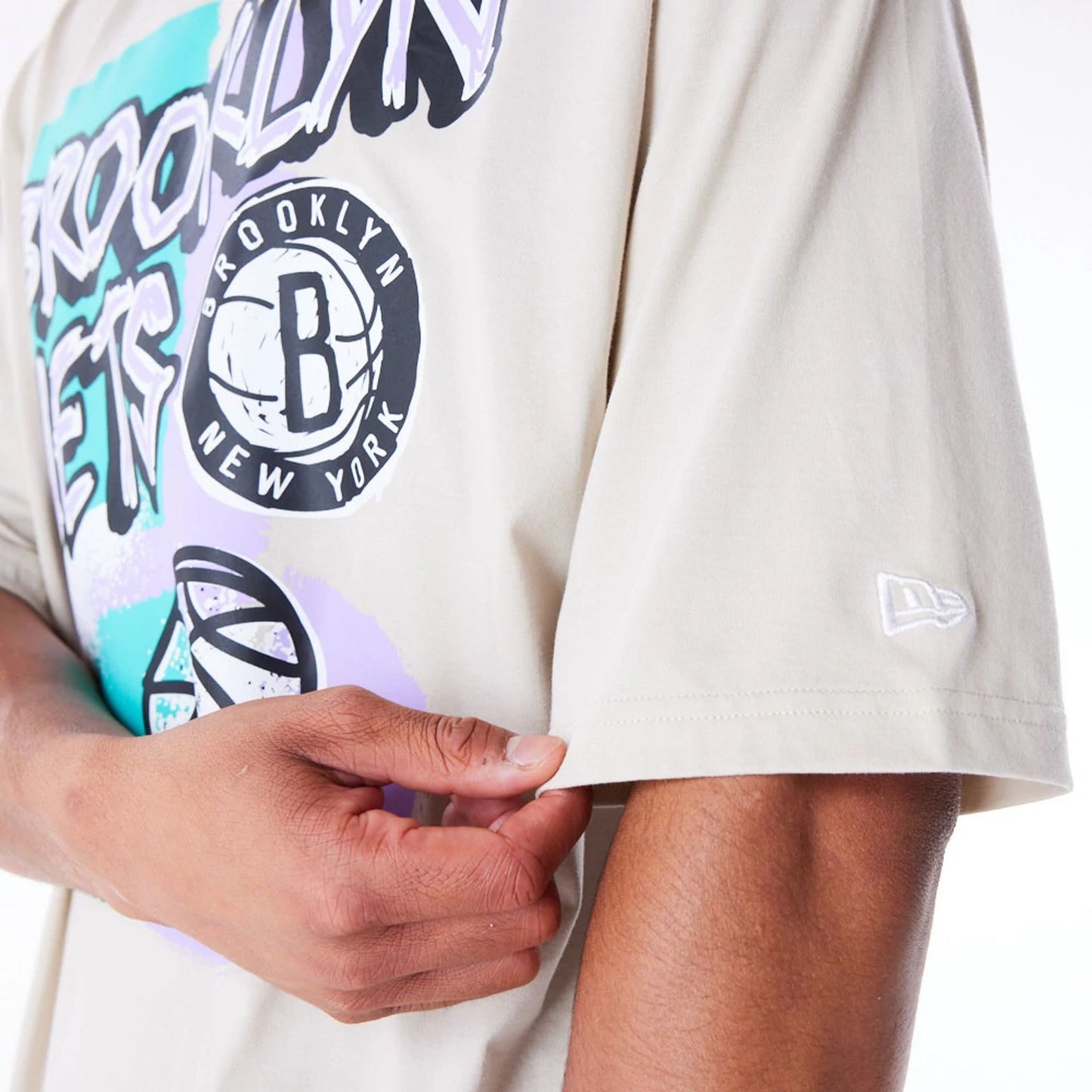 The Male model is wearing Brooklyn Nets Retro Graphic Stone Oversized T-Shirt 5