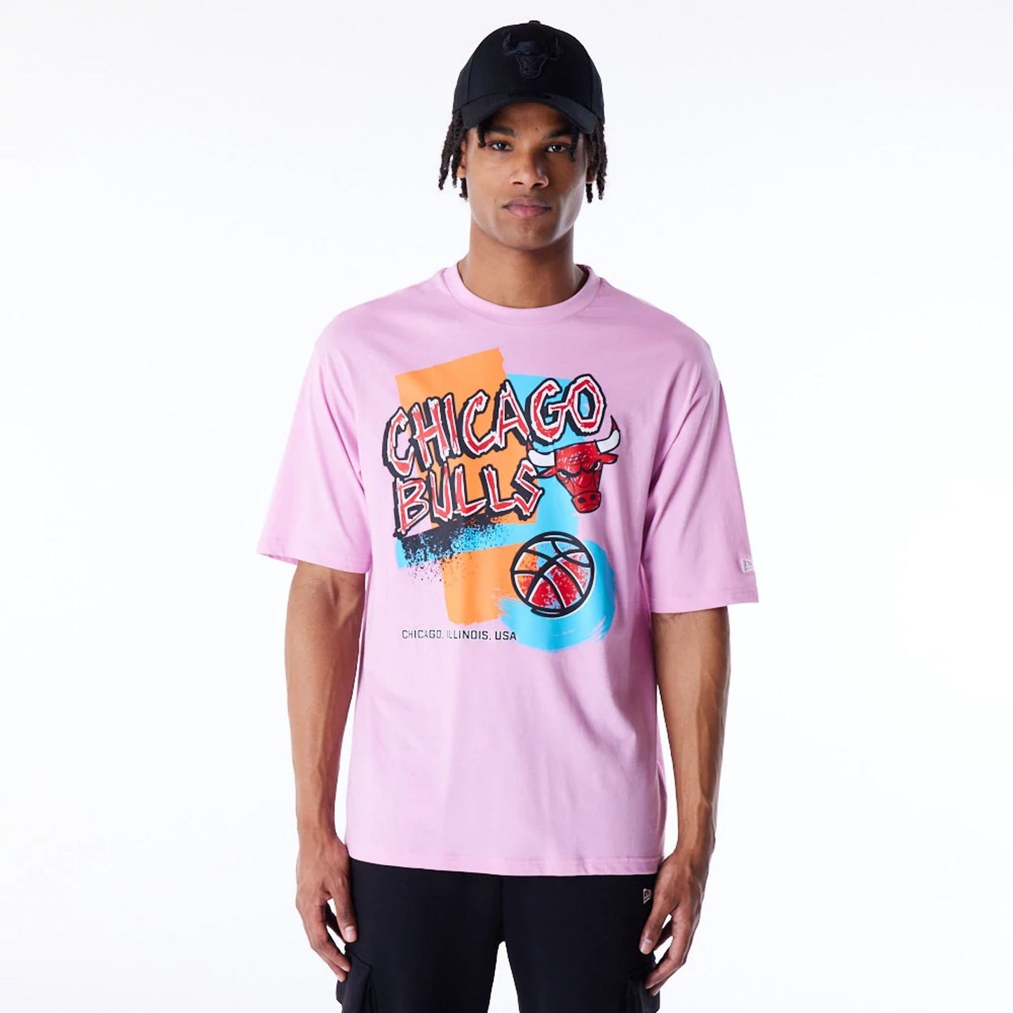 The Male model is wearing Chicago Bulls Retro Graphic Pastel Pink Oversized T-Shirt 1