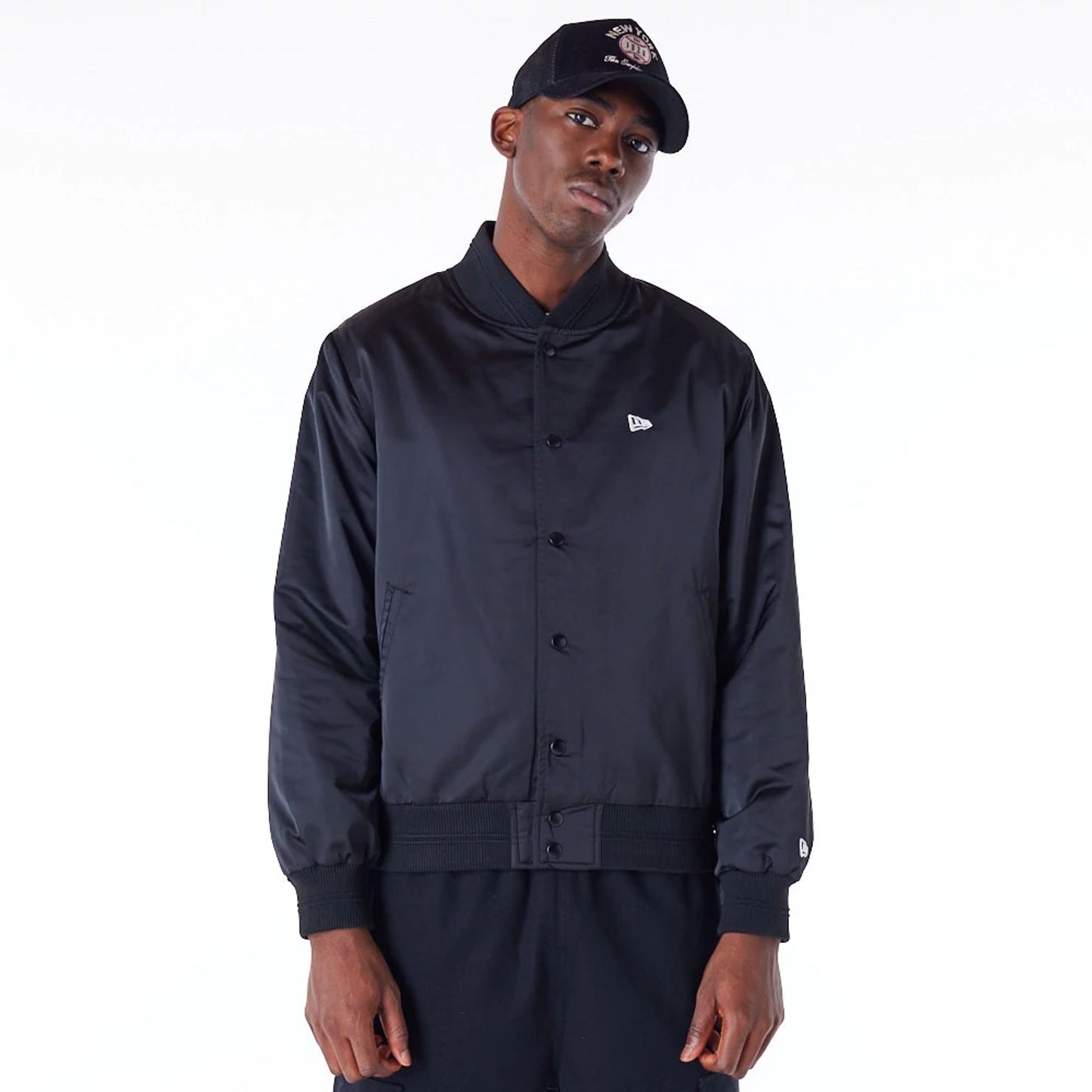 The Male model is wearing New Era Satin Graphic Black Bomber Jacket 1