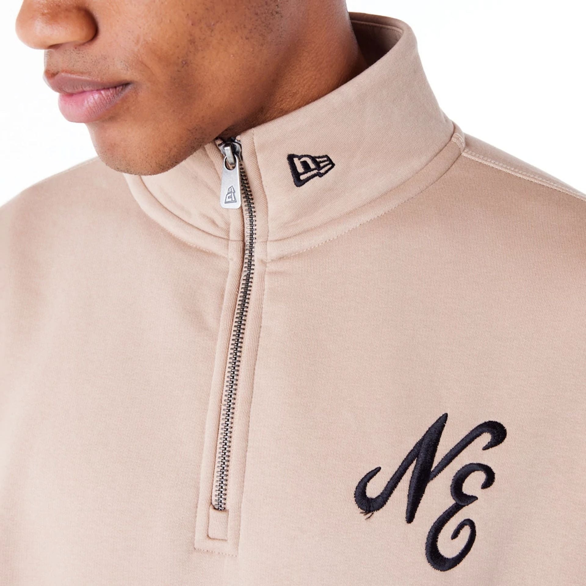 The Male model is wearing New Era Lifestyle Beige Quarter-Zip Sweater 5