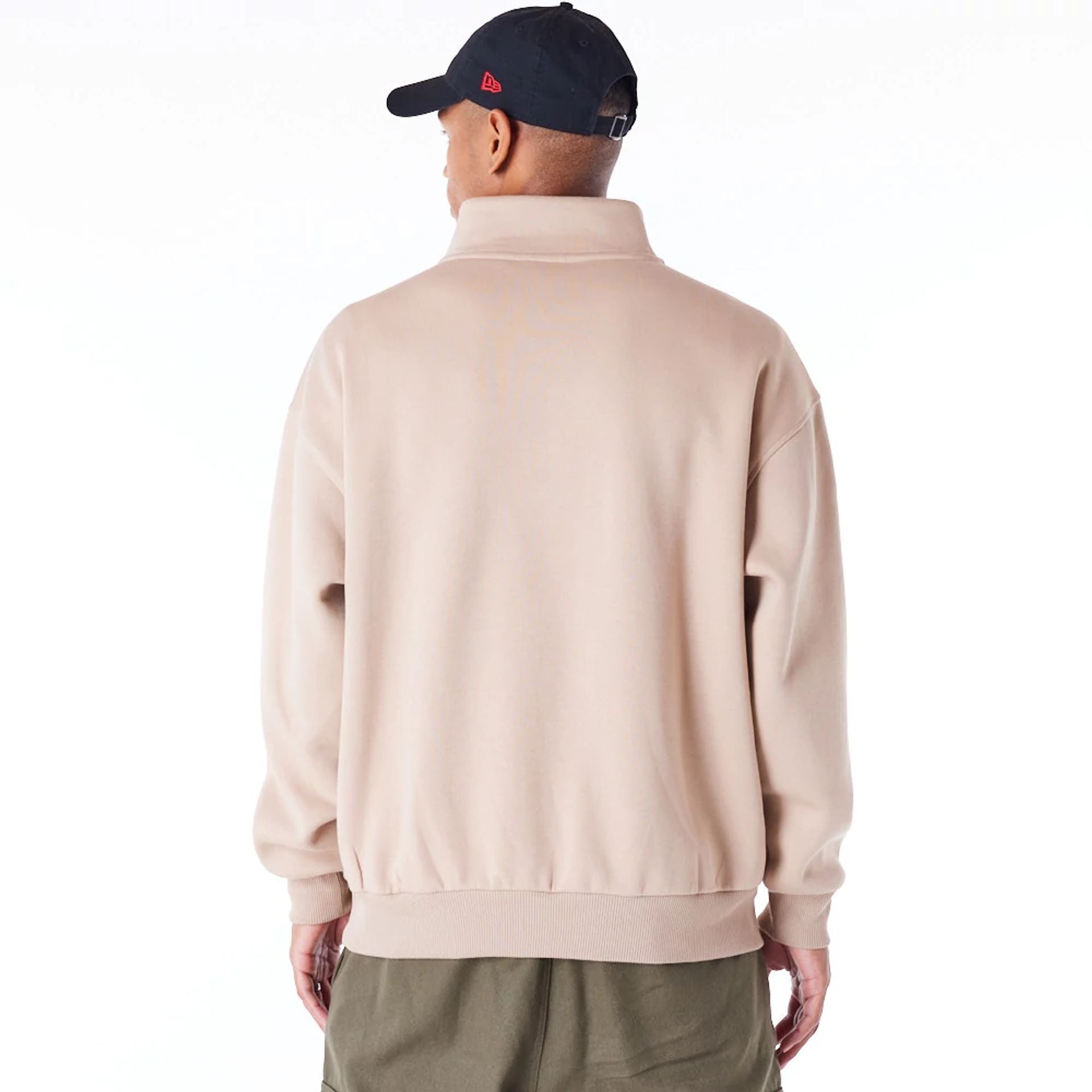 The Male model is wearing New Era Lifestyle Beige Quarter-Zip Sweater 7