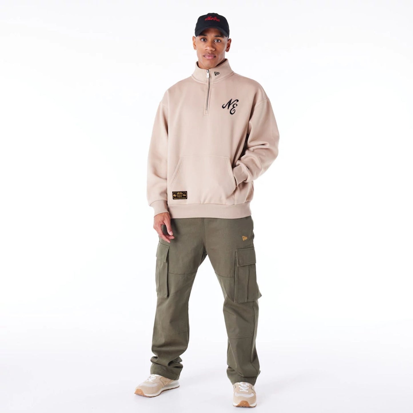 The Male model is wearing New Era Lifestyle Beige Quarter-Zip Sweater 8