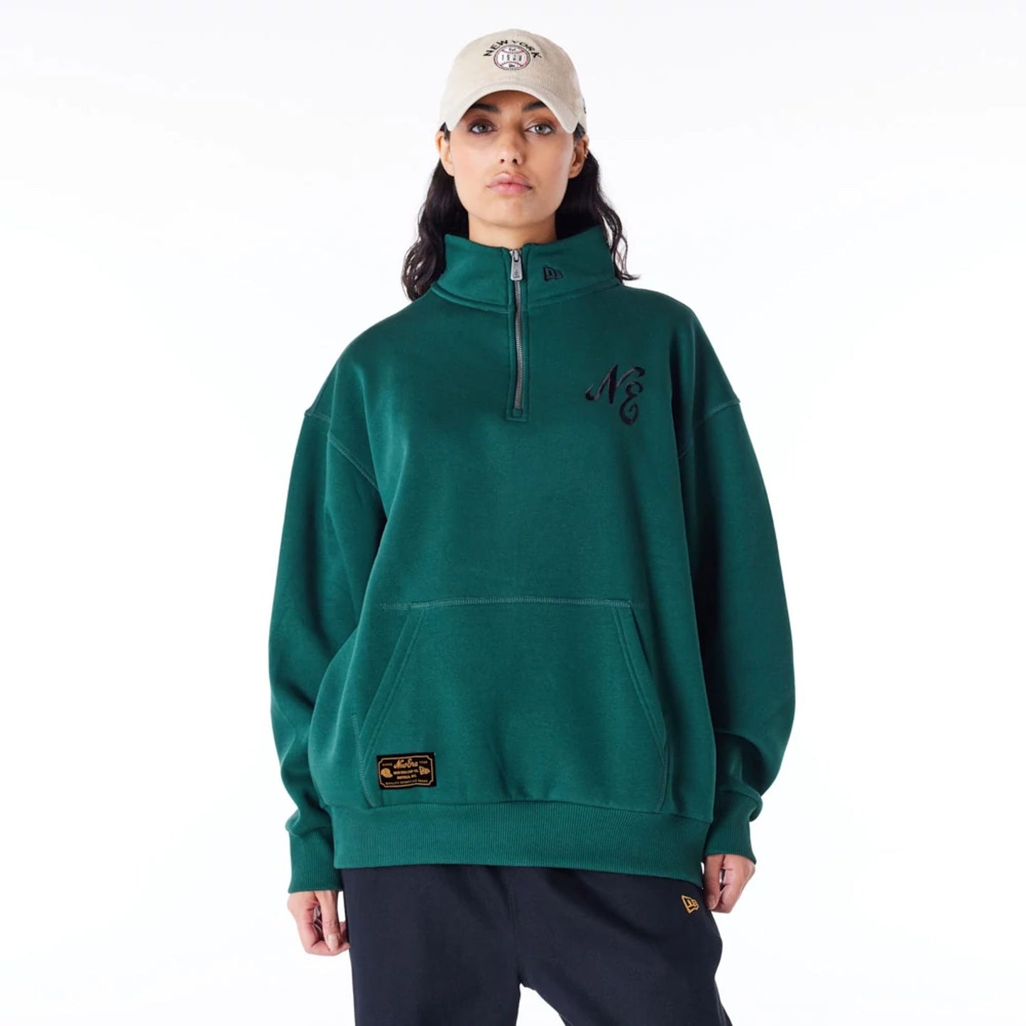 The Male model is wearing New Era Lifestyle Dark Green Quarter-Zip Sweater 3