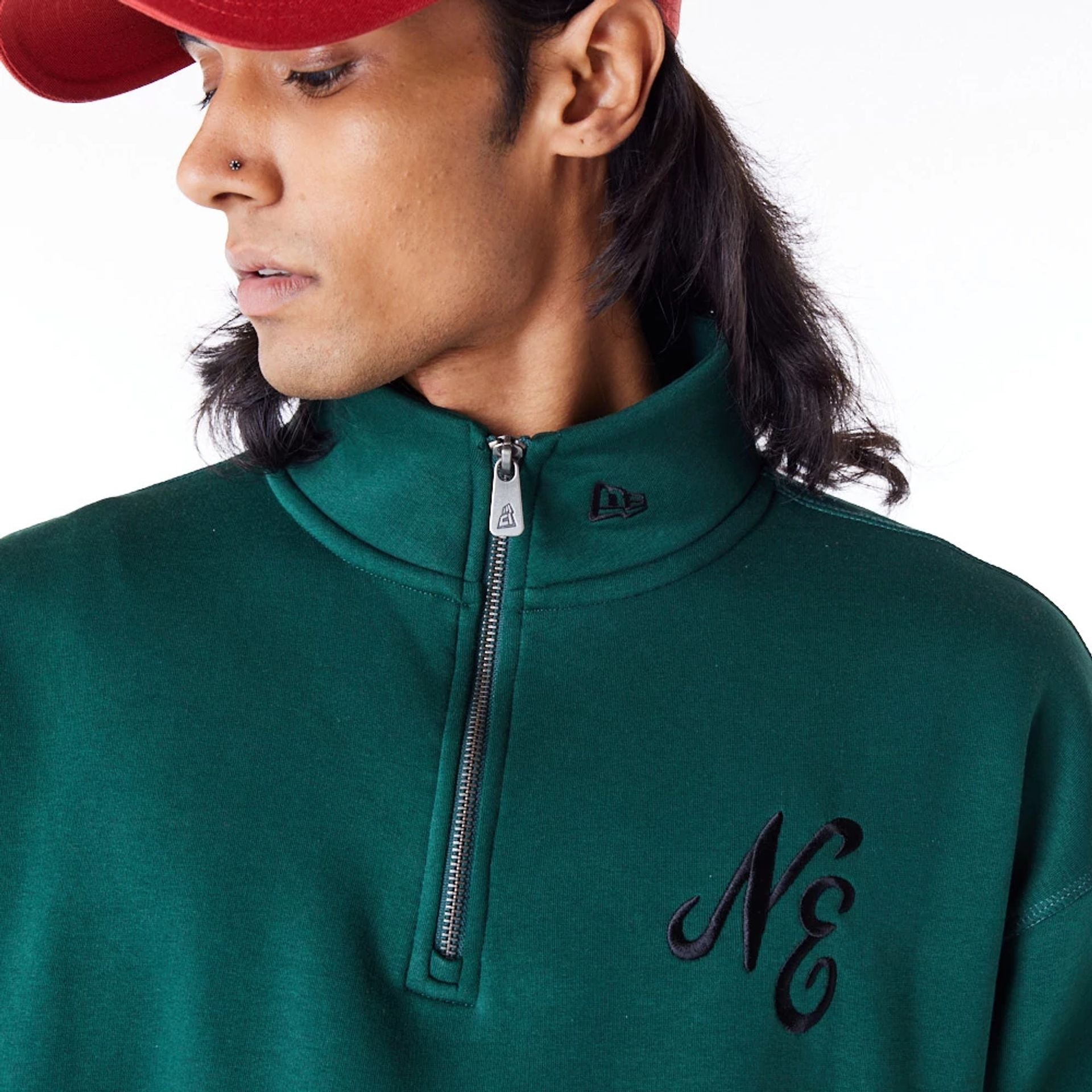 The Male model is wearing New Era Lifestyle Dark Green Quarter-Zip Sweater 5