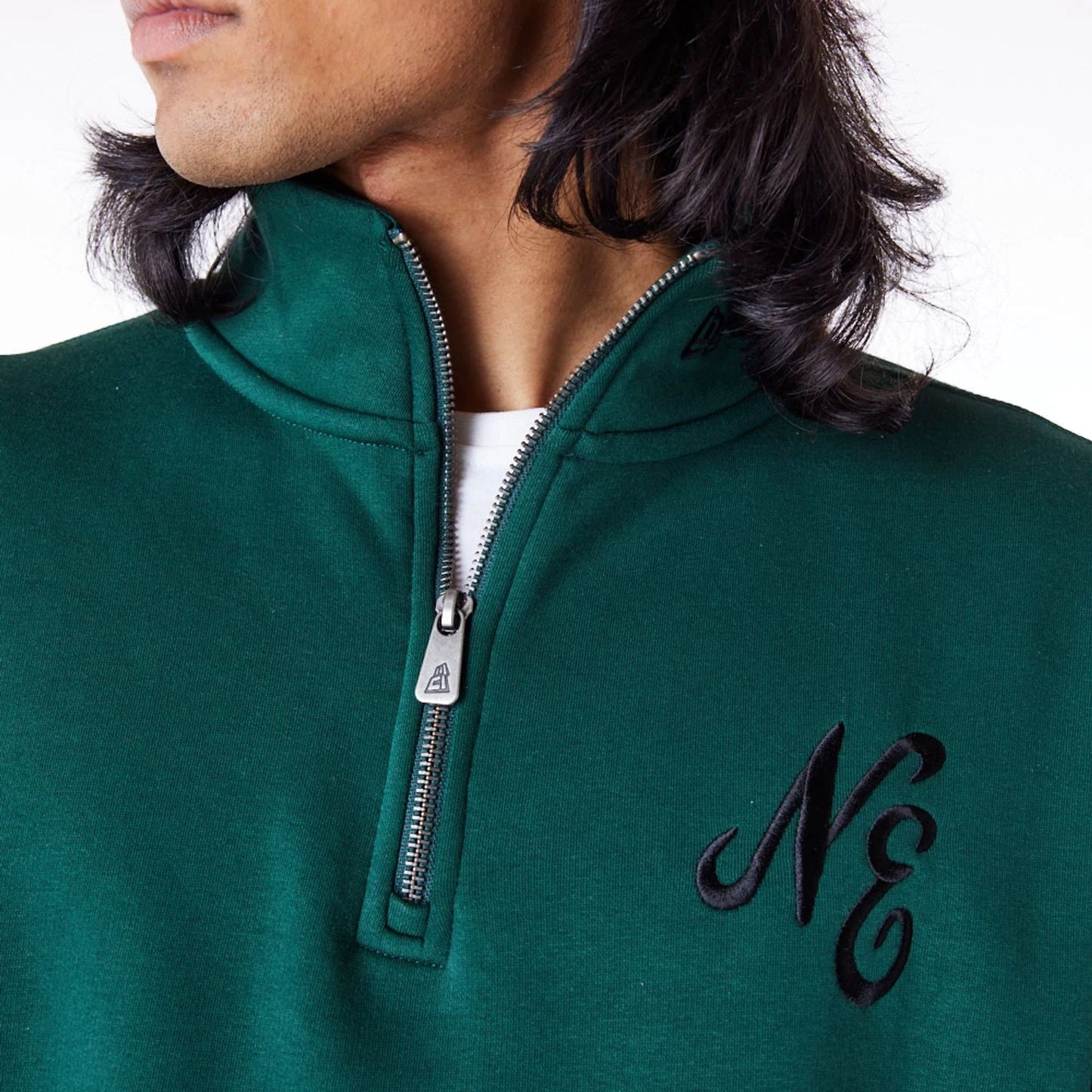 The Male model is wearing New Era Lifestyle Dark Green Quarter-Zip Sweater 8