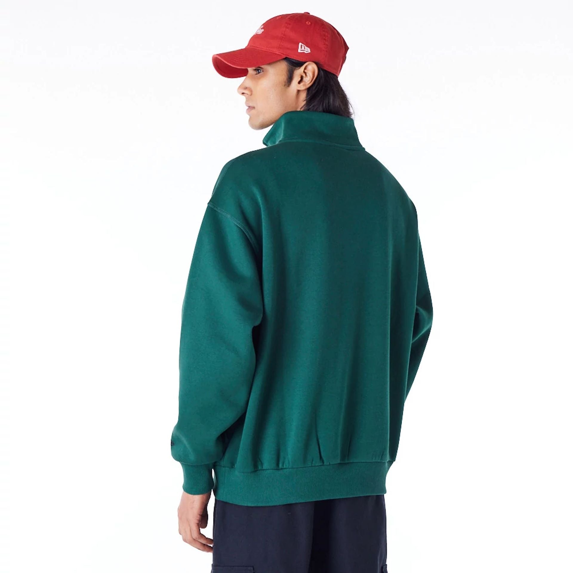 The Male model is wearing New Era Lifestyle Dark Green Quarter-Zip Sweater 9