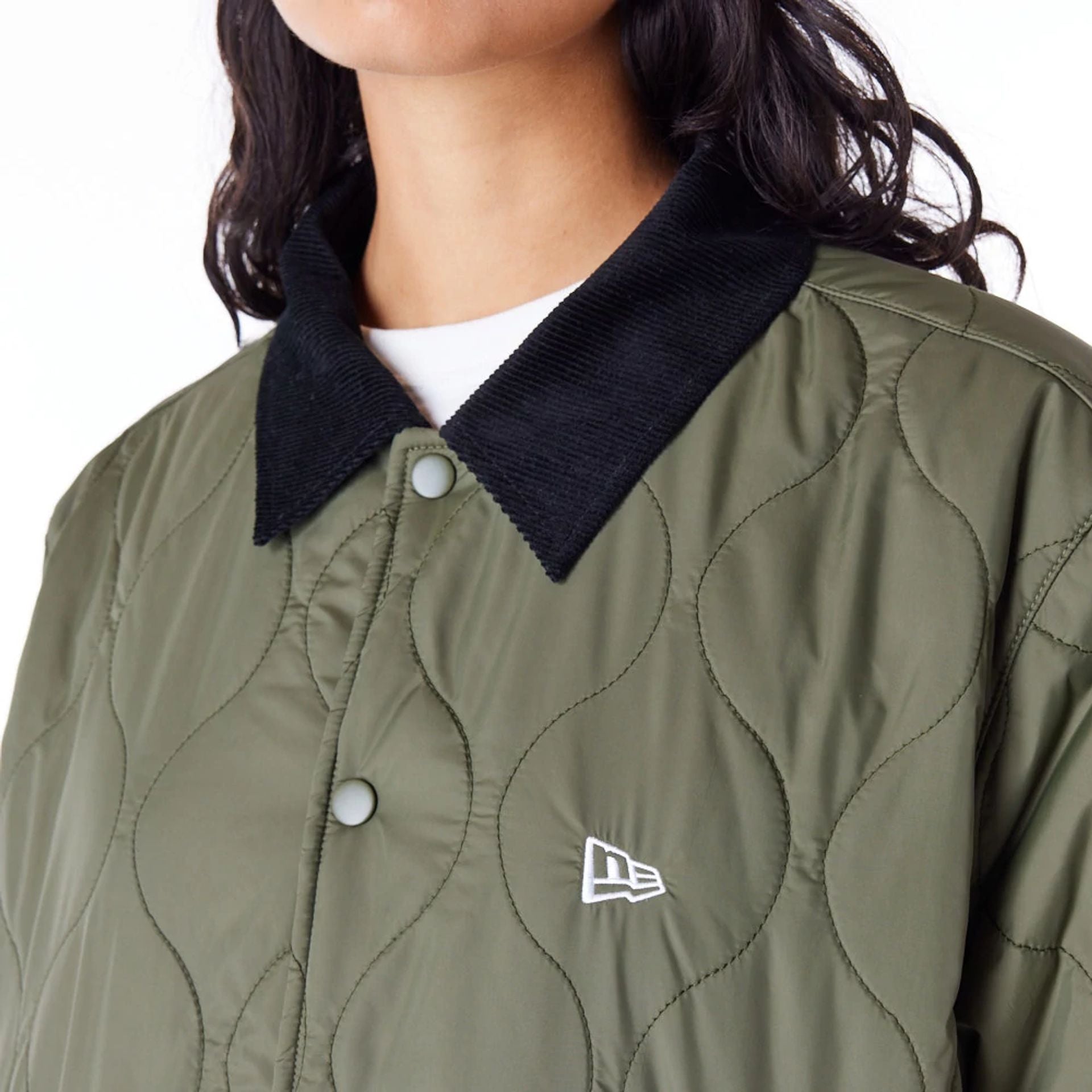 The Male model is wearing New Era Green Quilted Coach Jacket 5