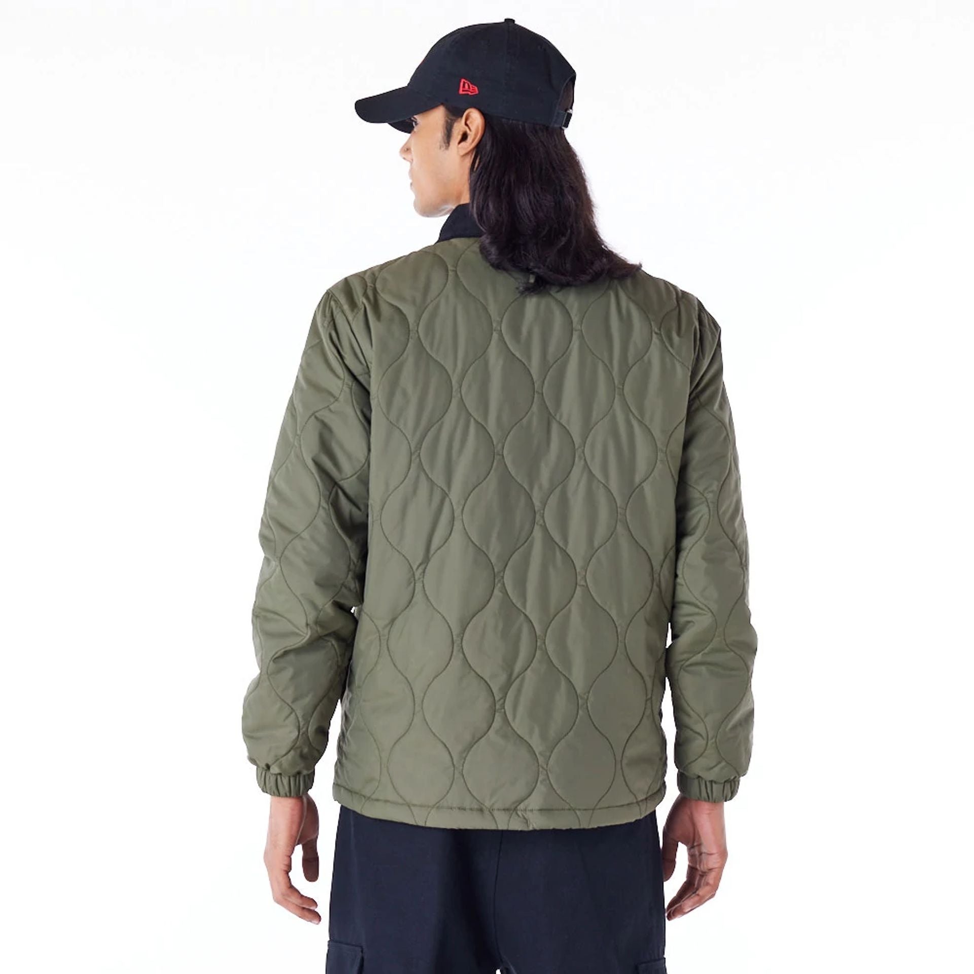 The Male model is wearing New Era Green Quilted Coach Jacket 7