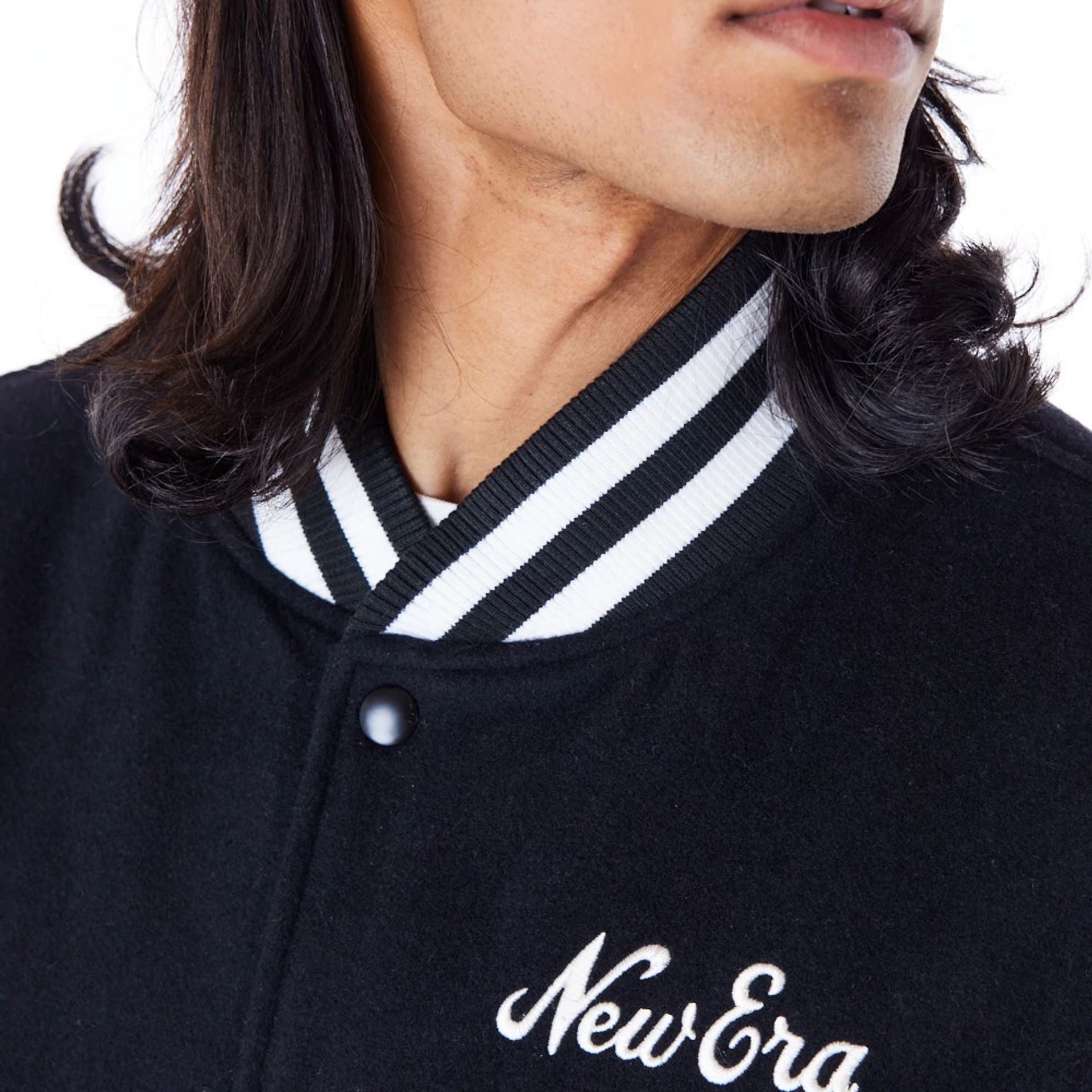 The Male model is wearing New Era Black Varsity Jacket 2