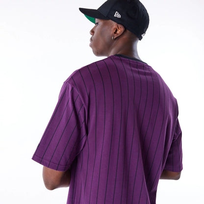 The Male model is wearing New Era Pinstripe Dark Purple Oversized T-Shirt 4