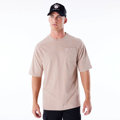 The Male model is wearing New Era Wash Beige Oversized T-Shirt 9